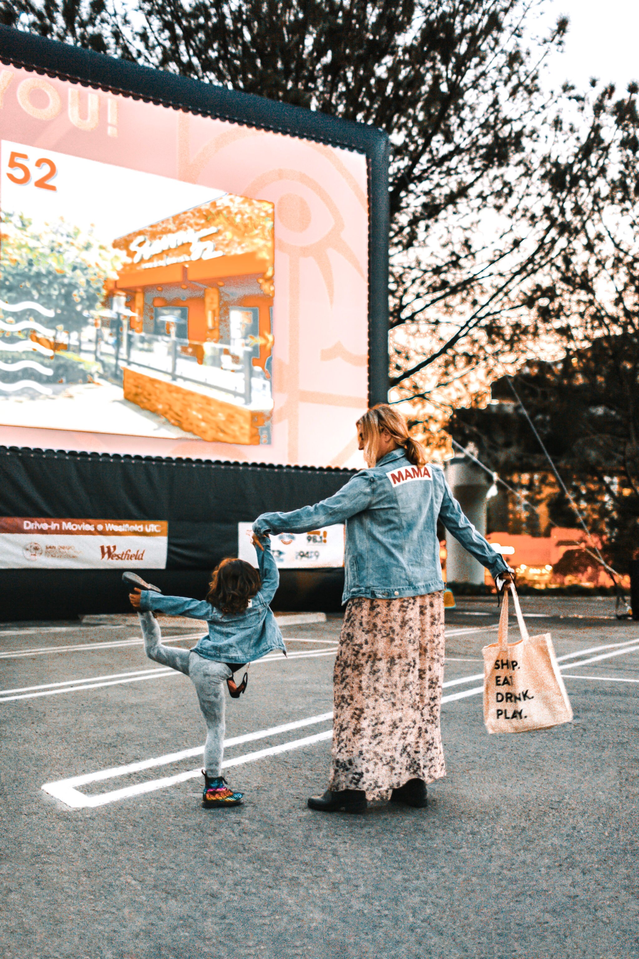 mom and dancing kid in parking lot