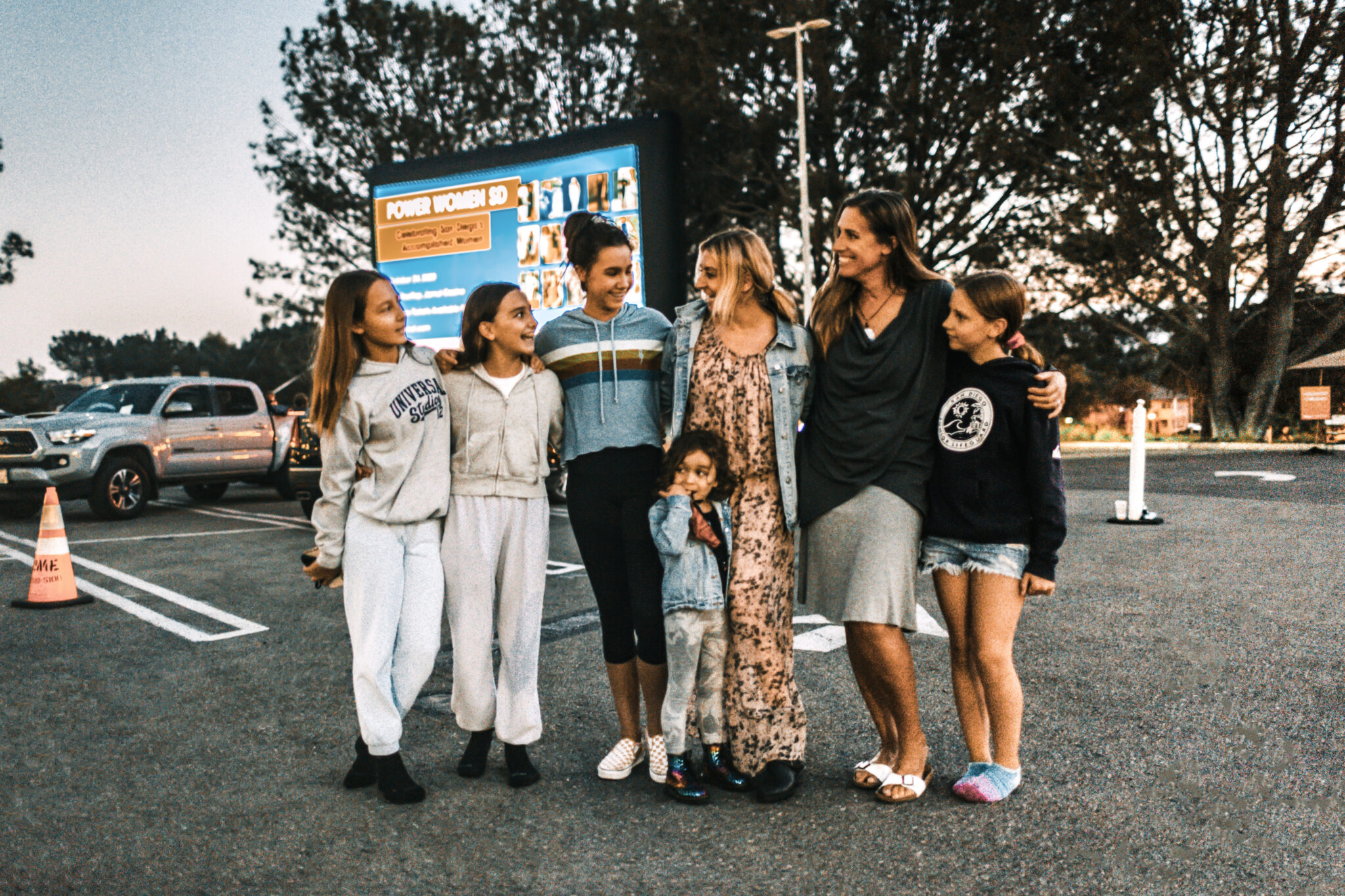 friends standing in parking lot