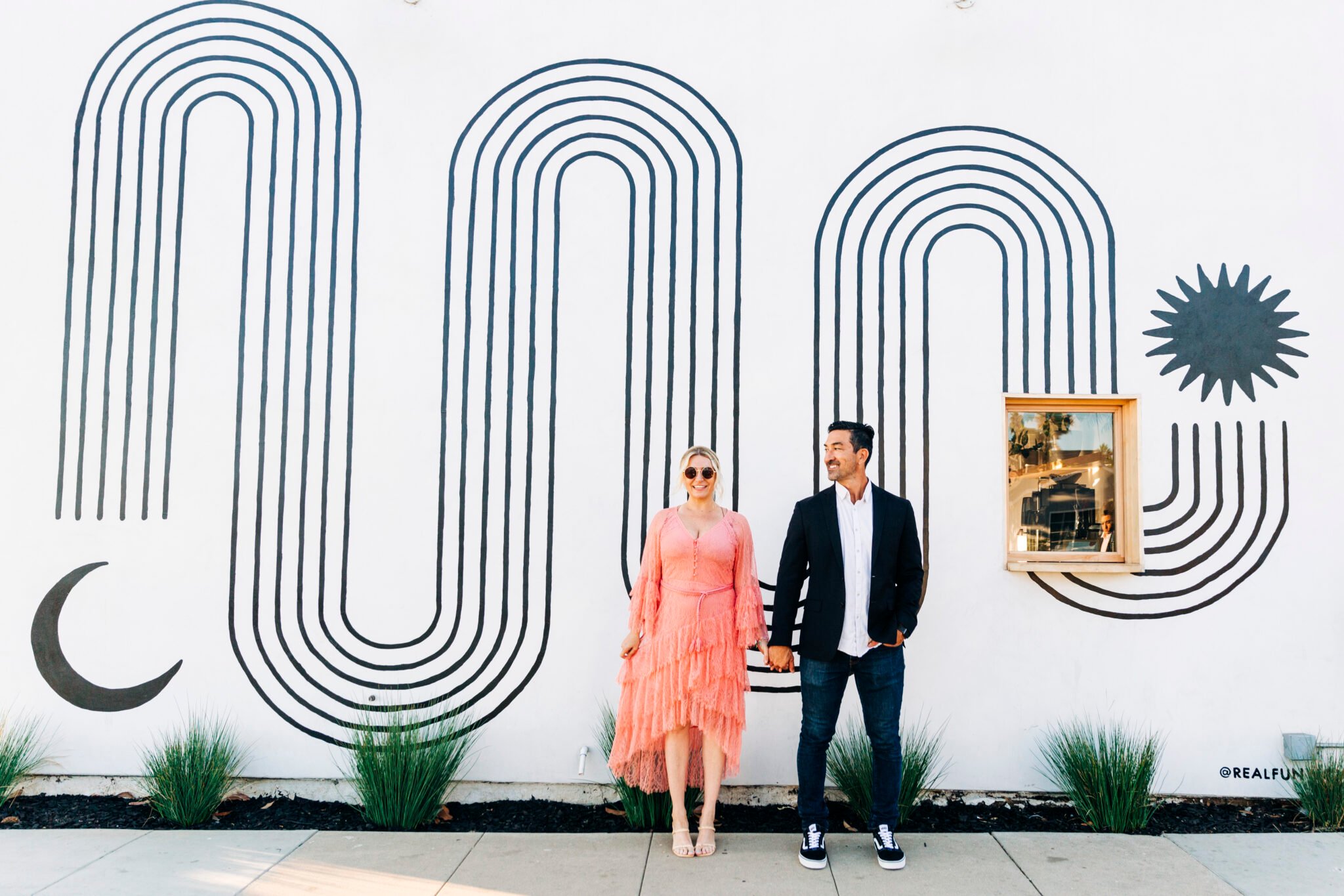 couple in front of mural