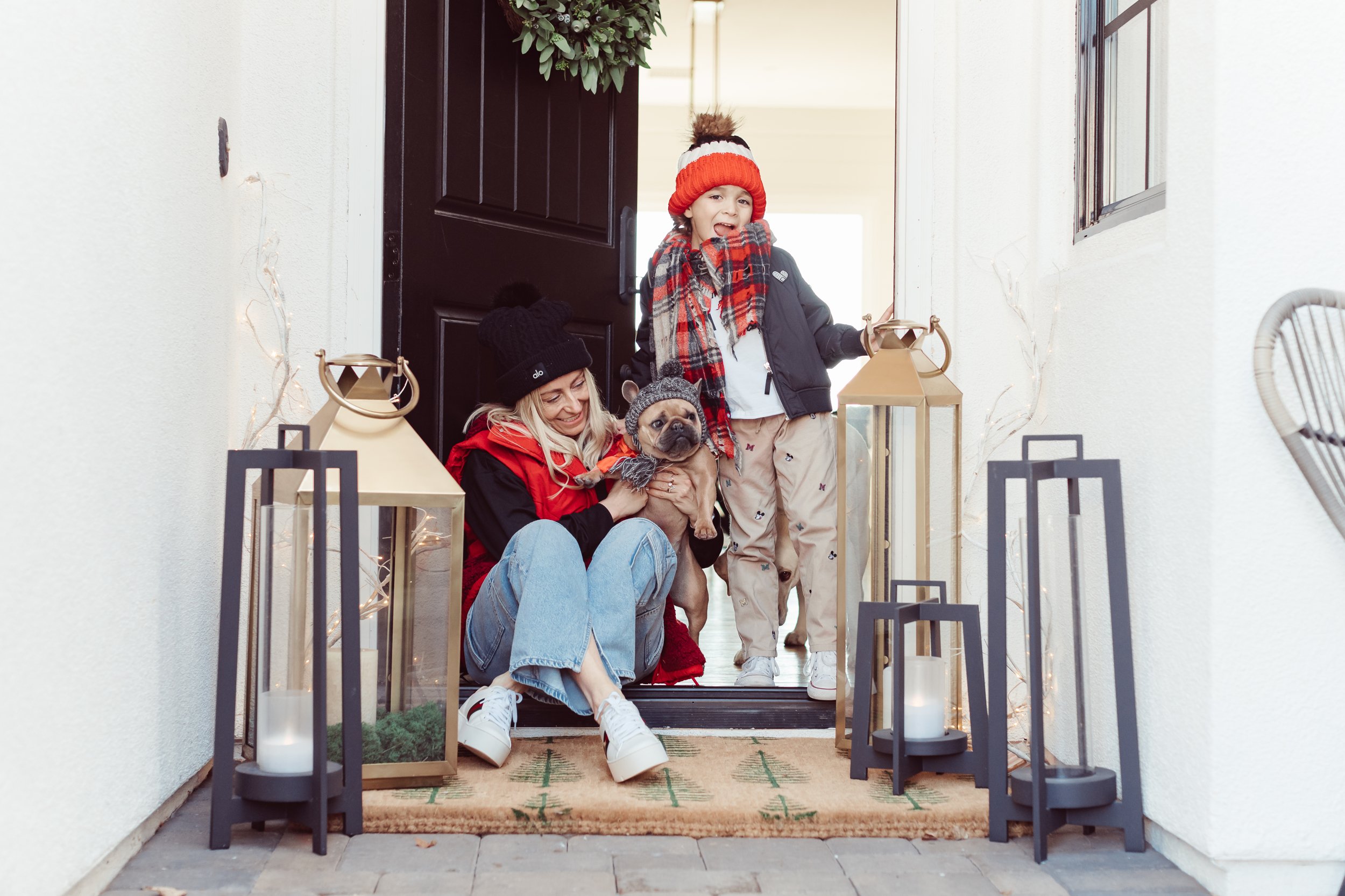 mom and son in doorway with dog