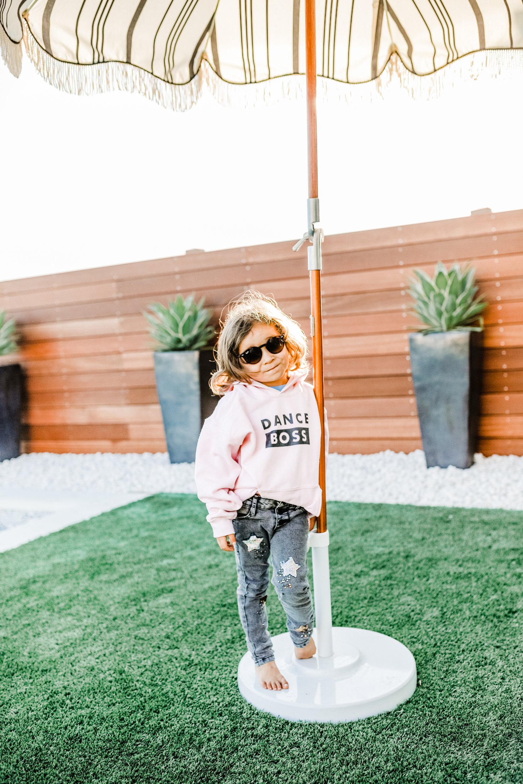 boy in backyard with sunglasses