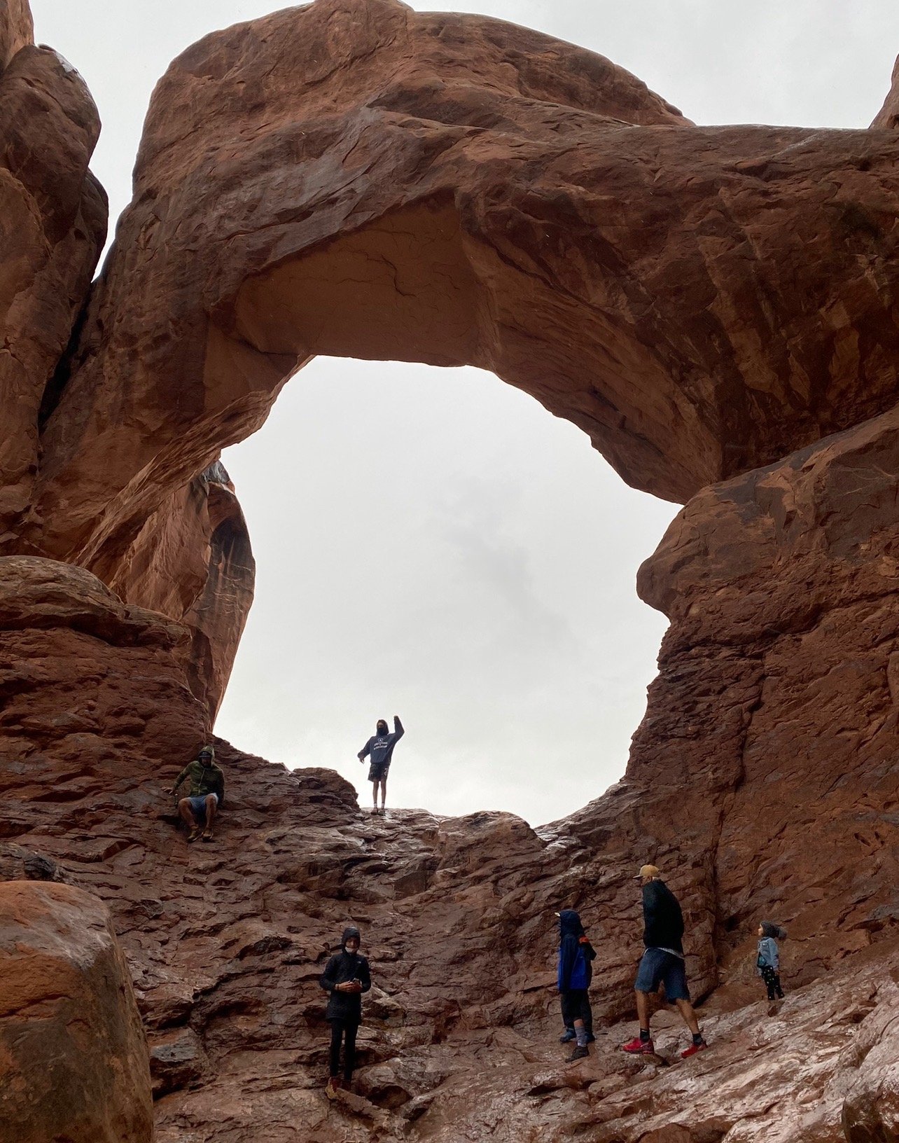 family exploring utah arches