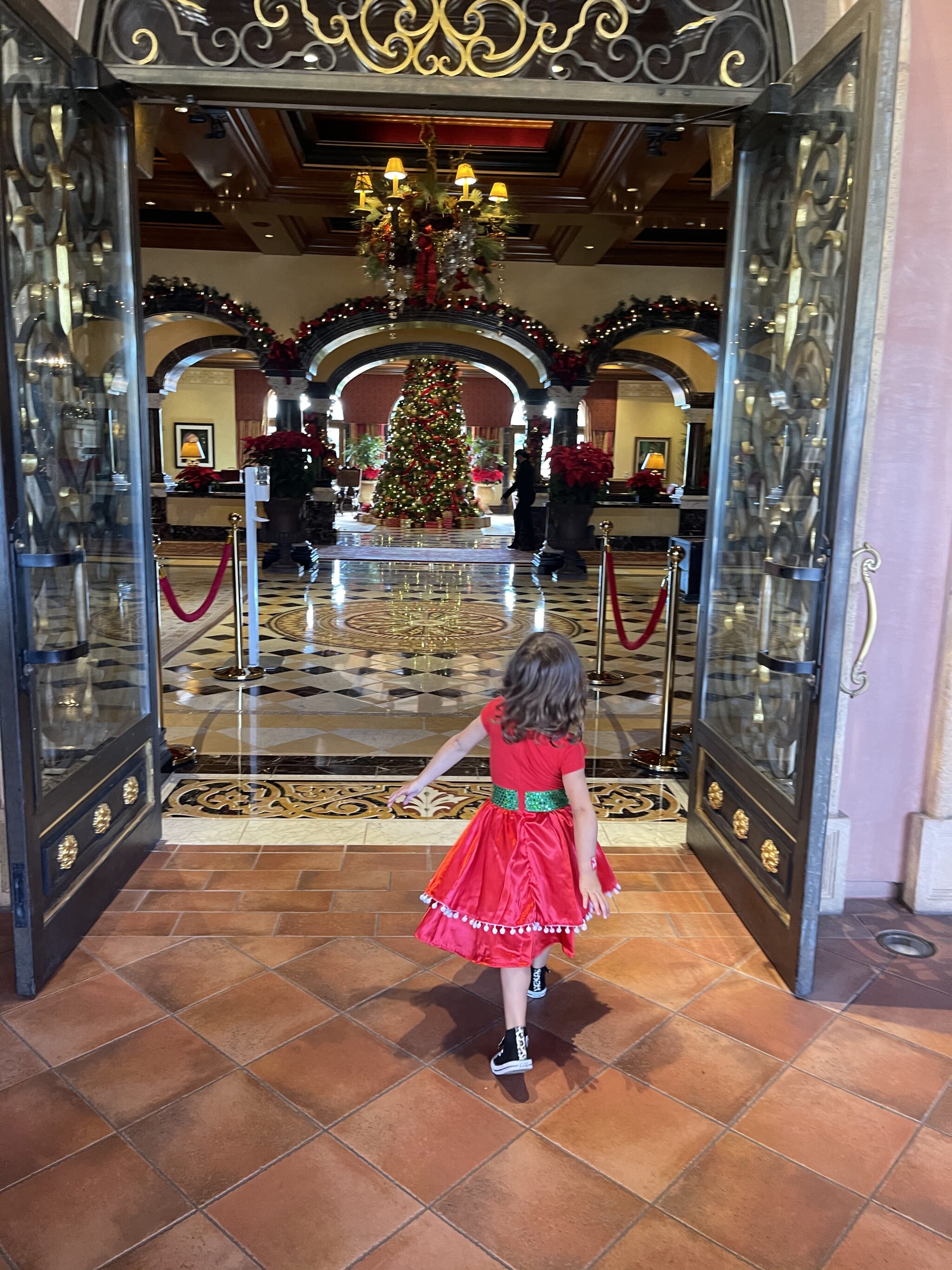 child walking into hotel