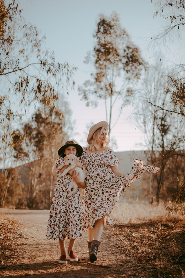 mom and daughter with dog