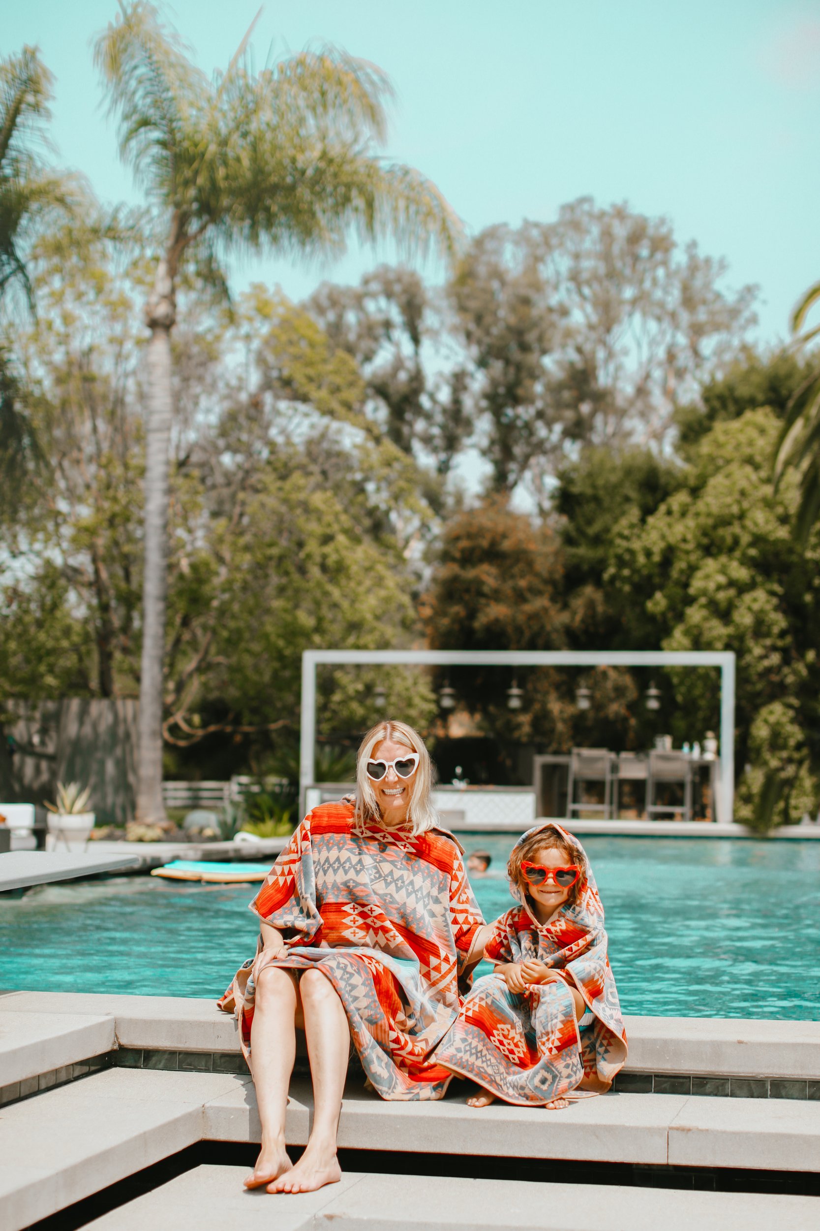 mom and kid by the pool