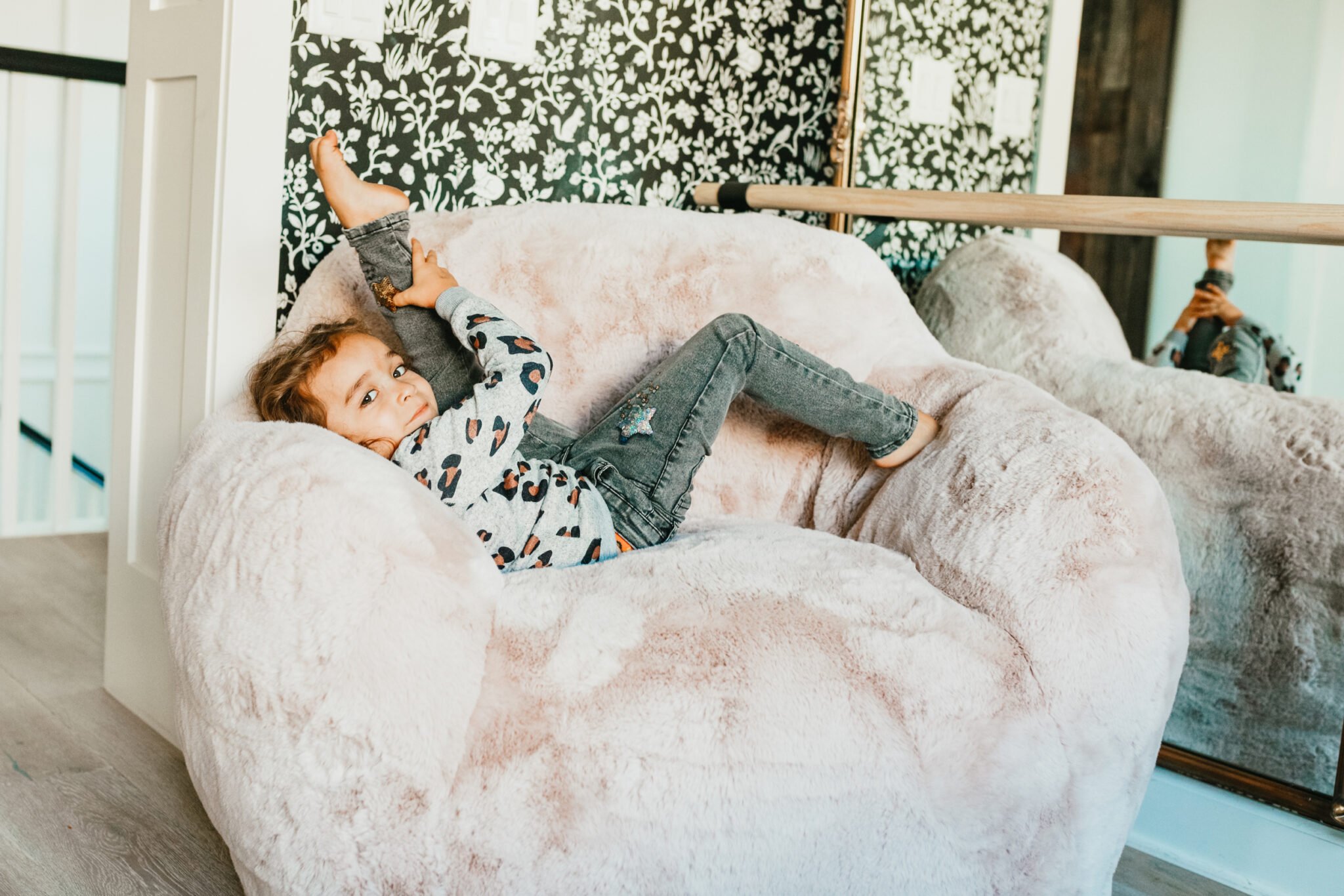 toddler dancing on chair