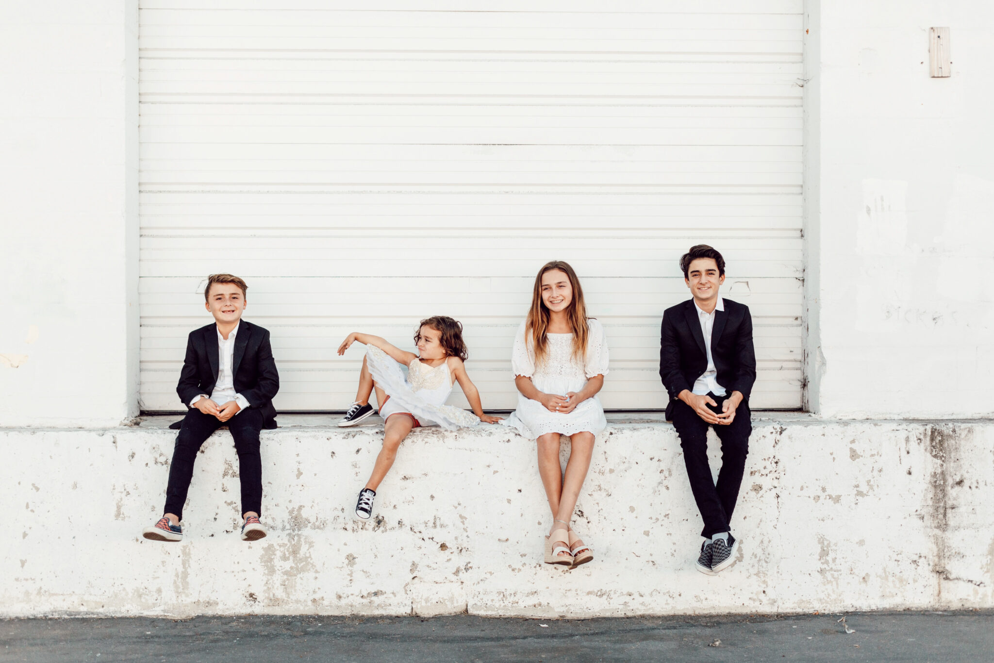 kids sitting outside together