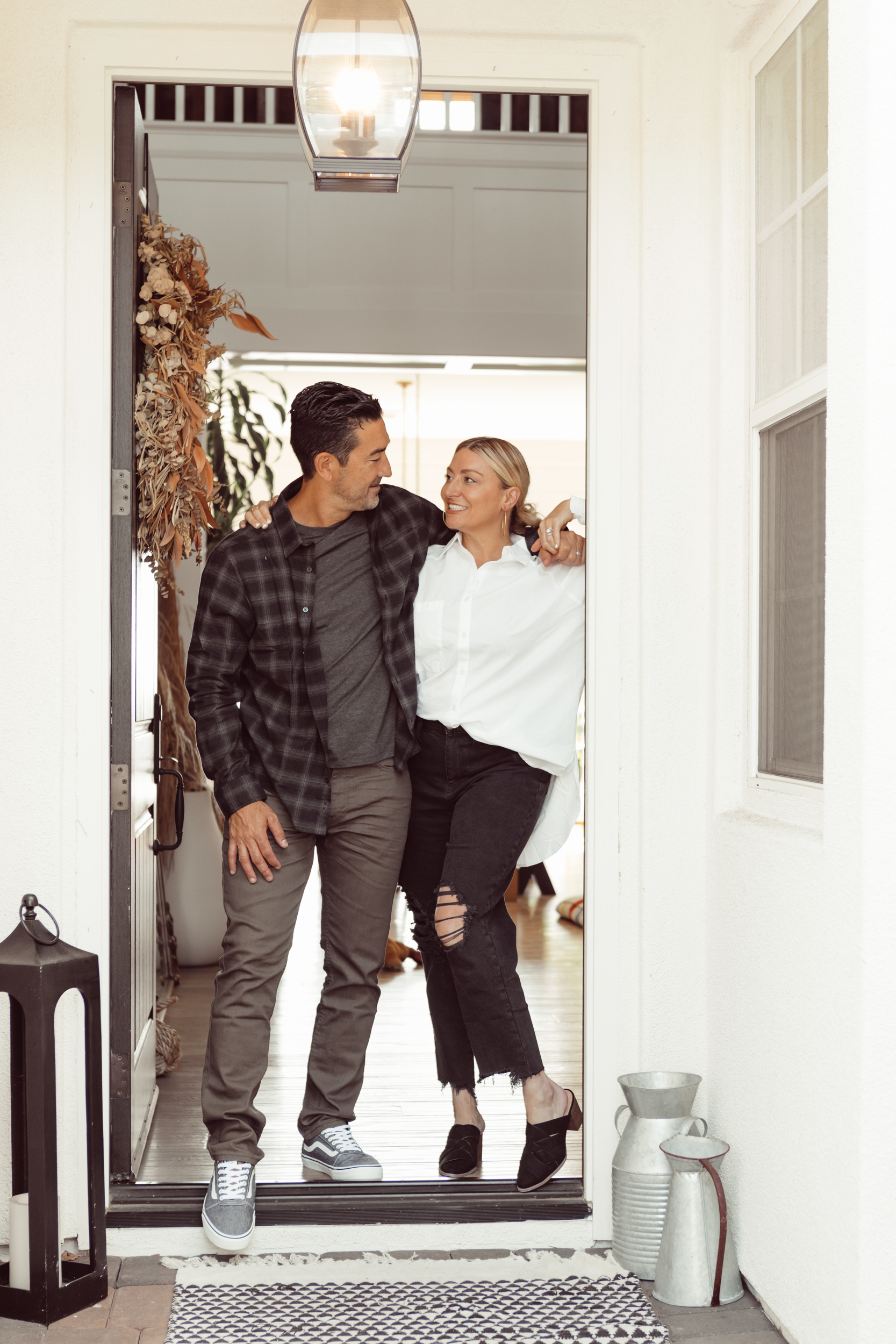 couple embracing in doorway