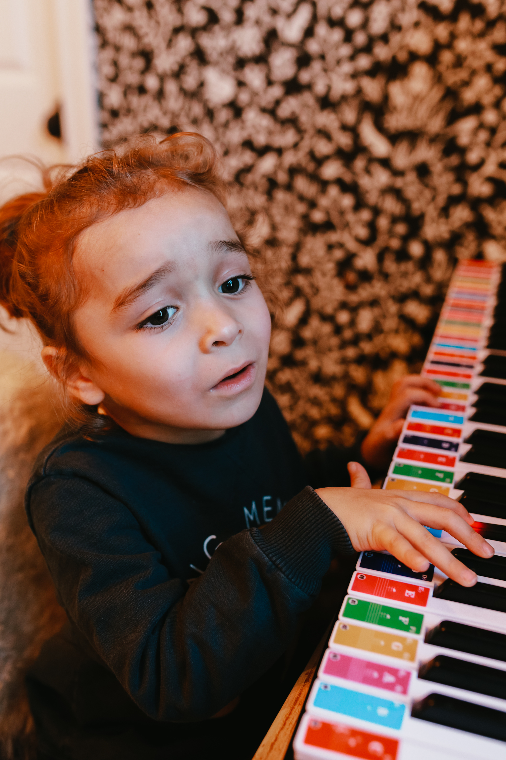 kid playing the piano