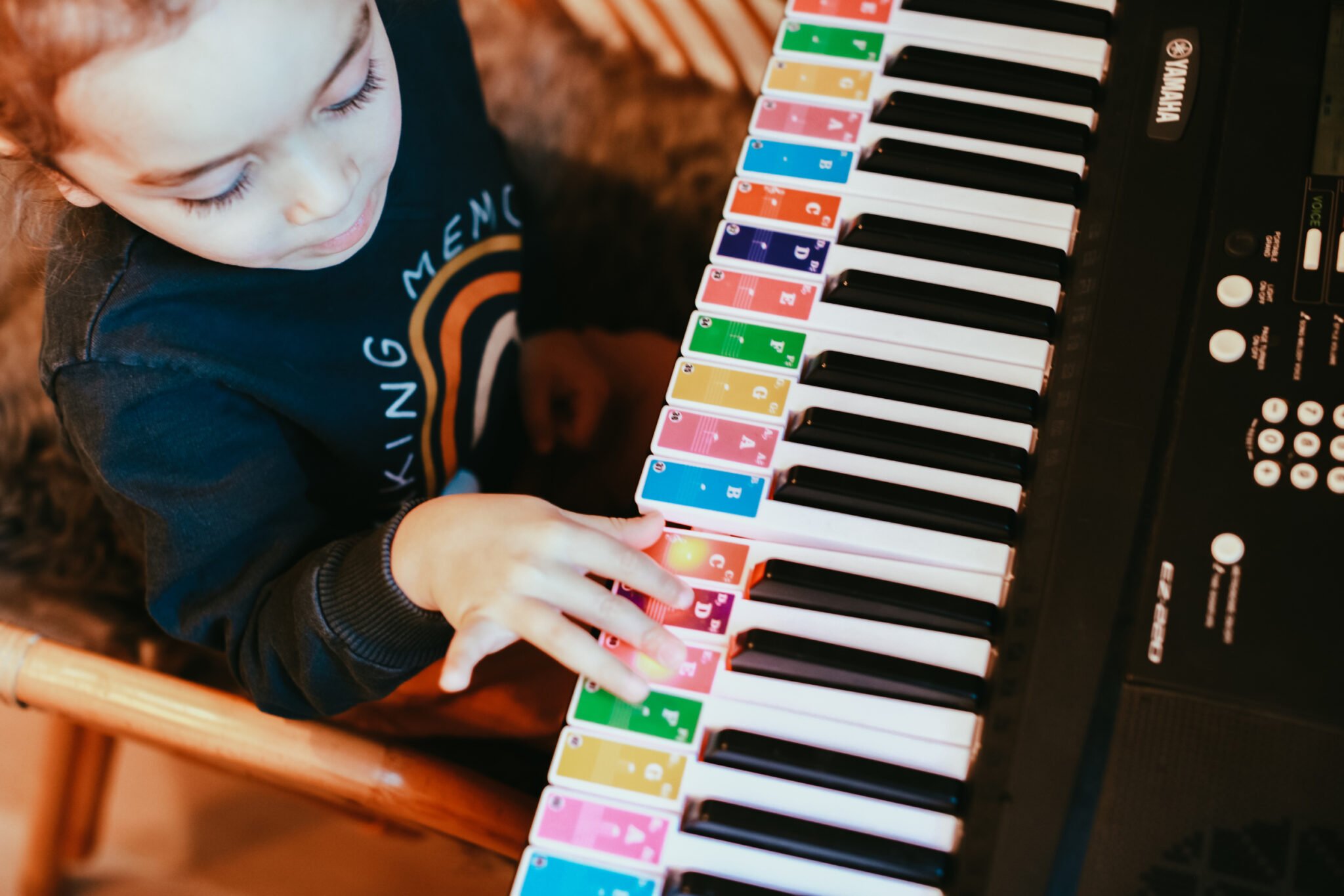 little boy playing the piano