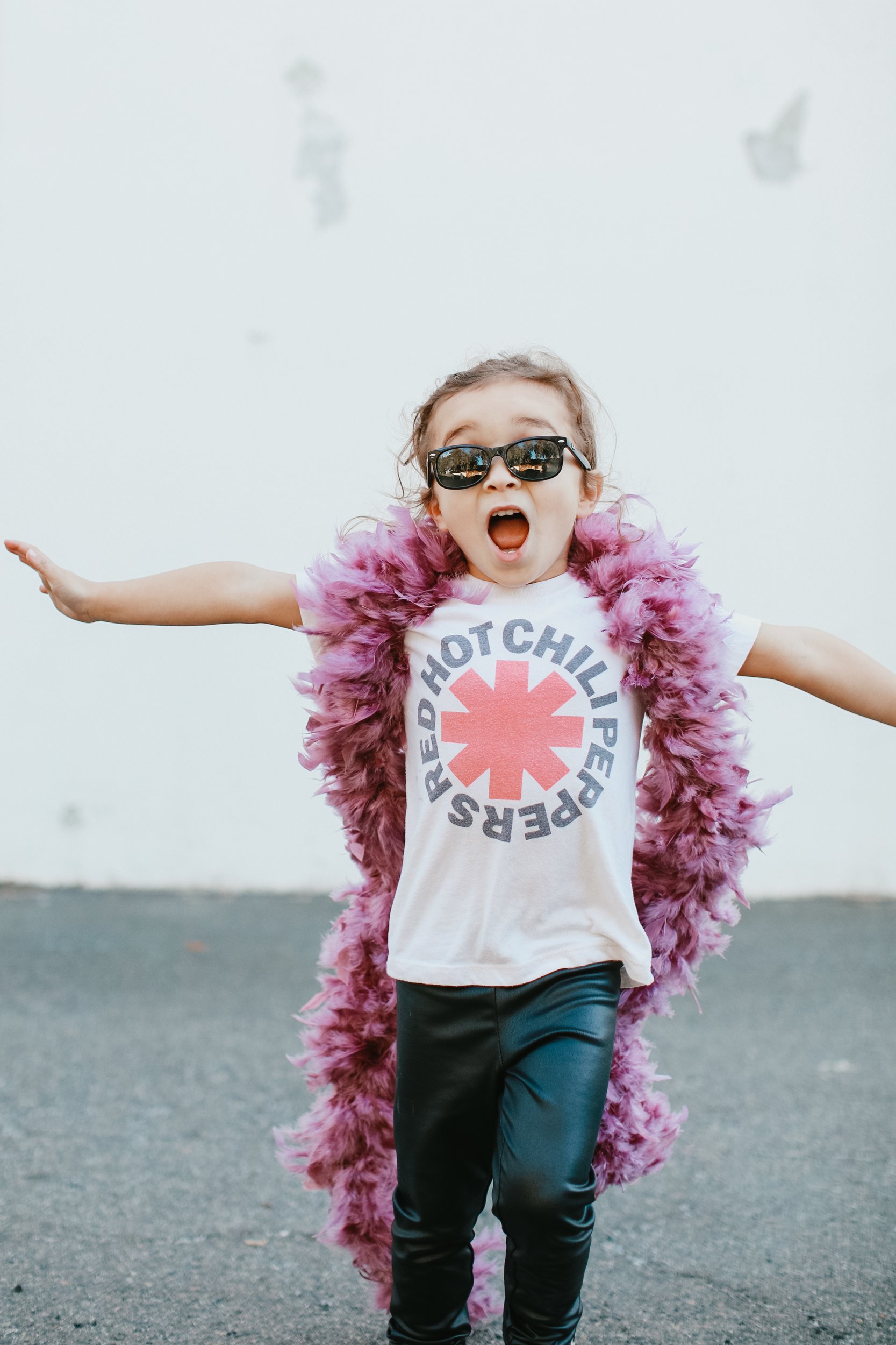 toddler in feather boa