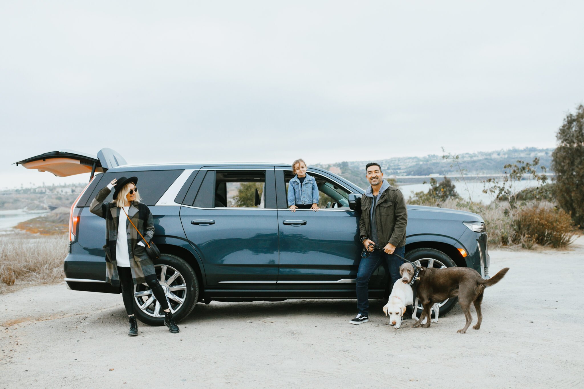 family standing near car