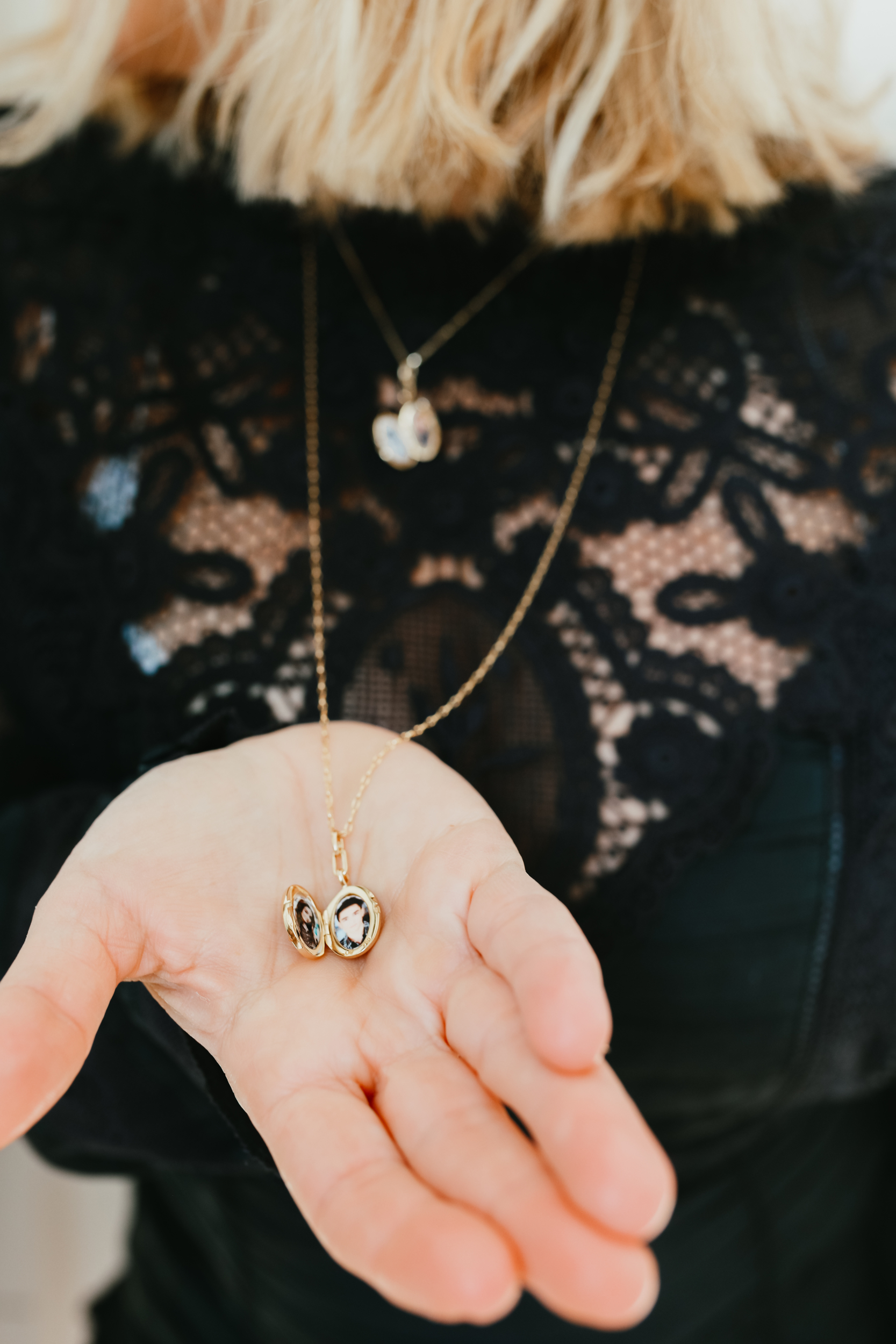 woman holding locket