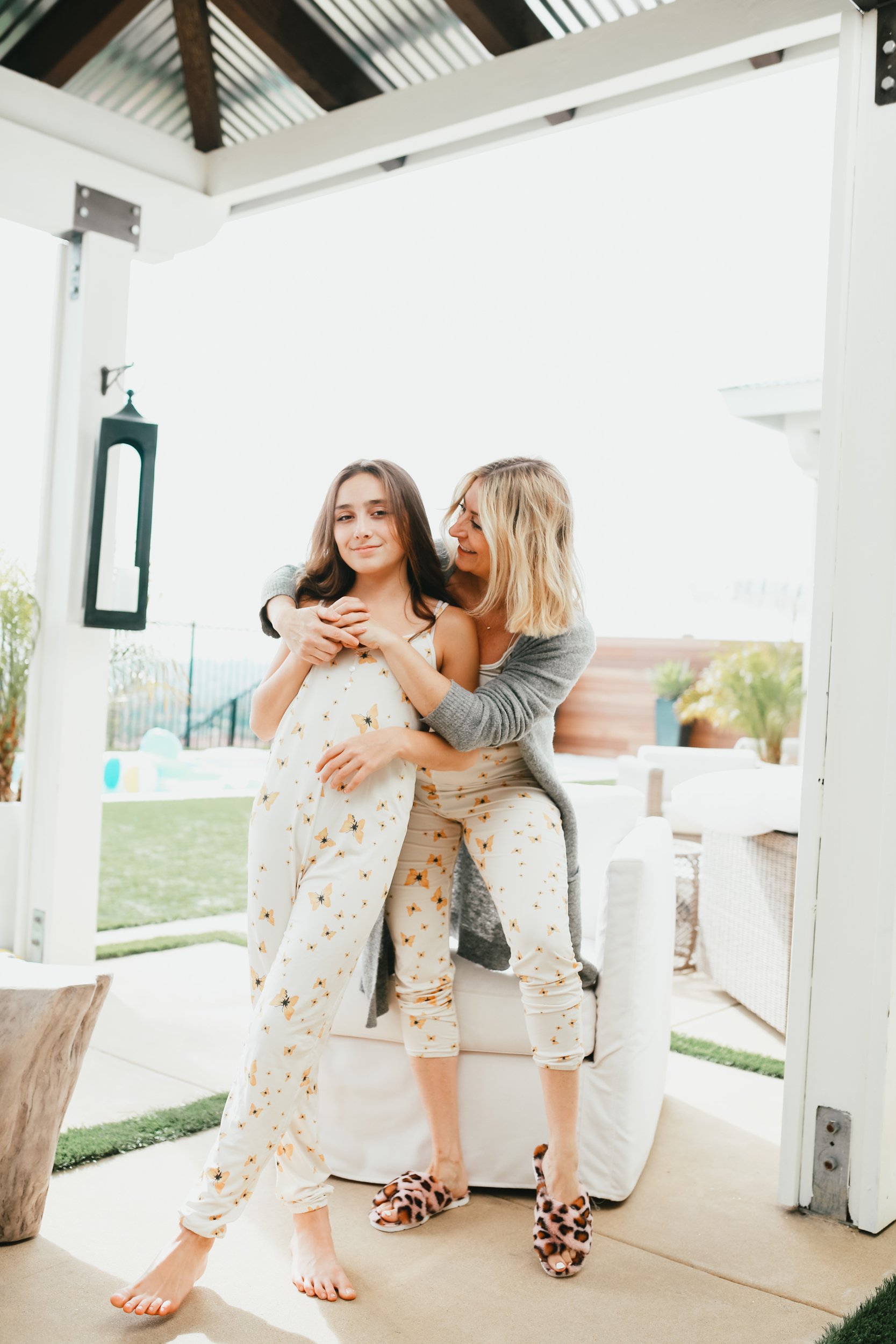 mom hugging daughter