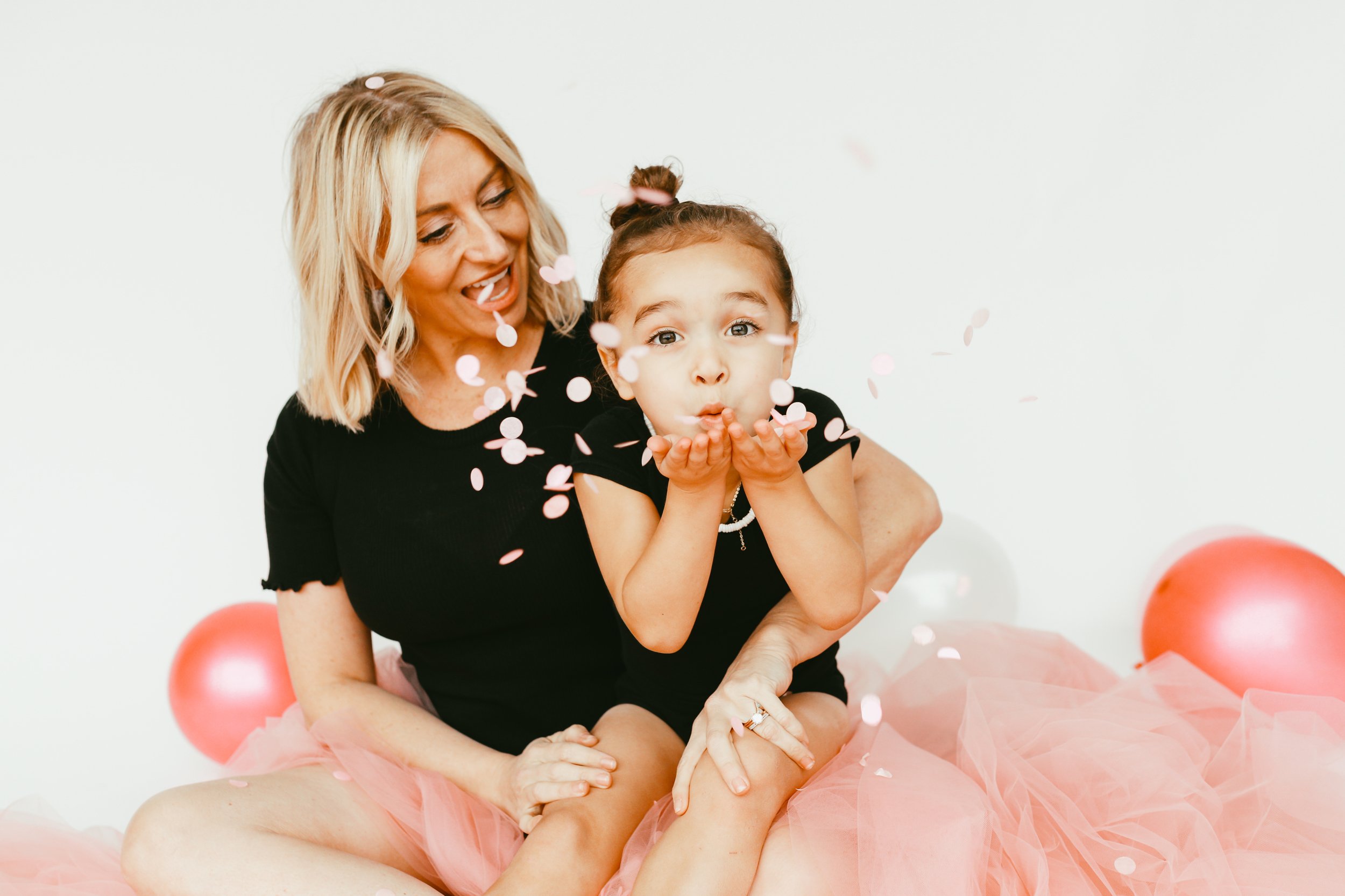 mom and son blowing flower petals as mother's day gifts