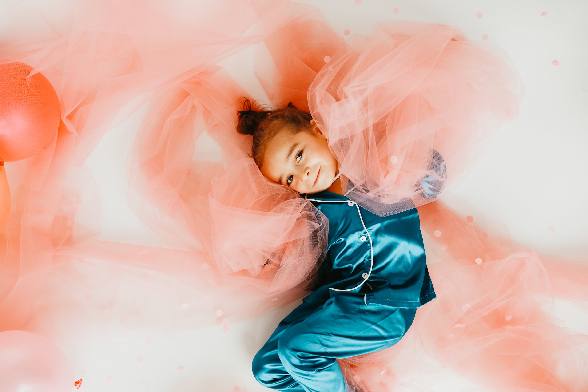 toddler playing in fabric