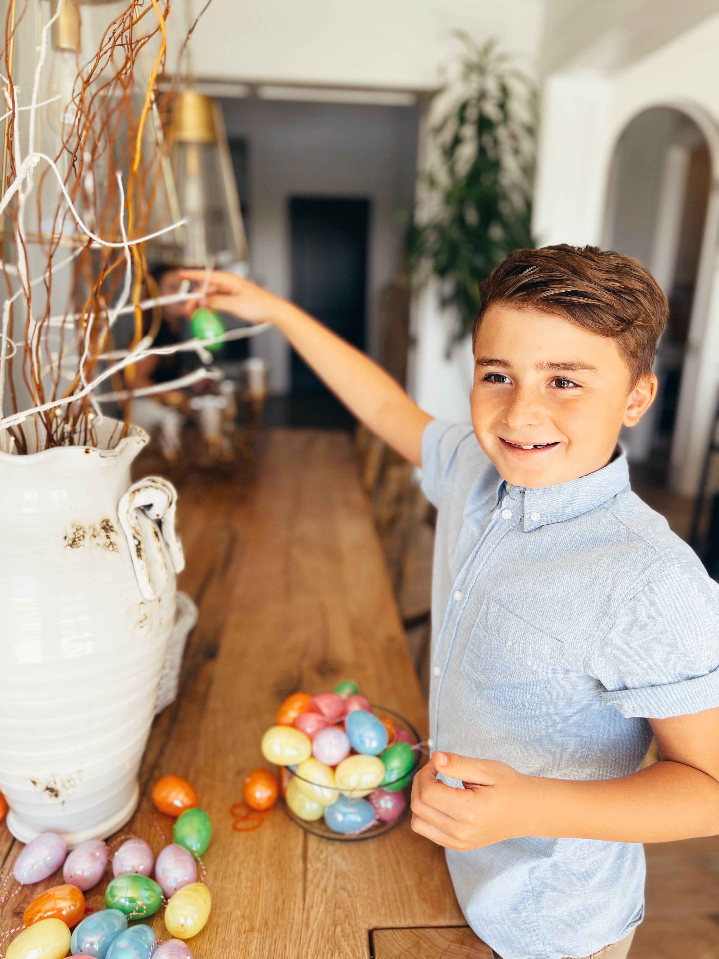 boy decorating for easter