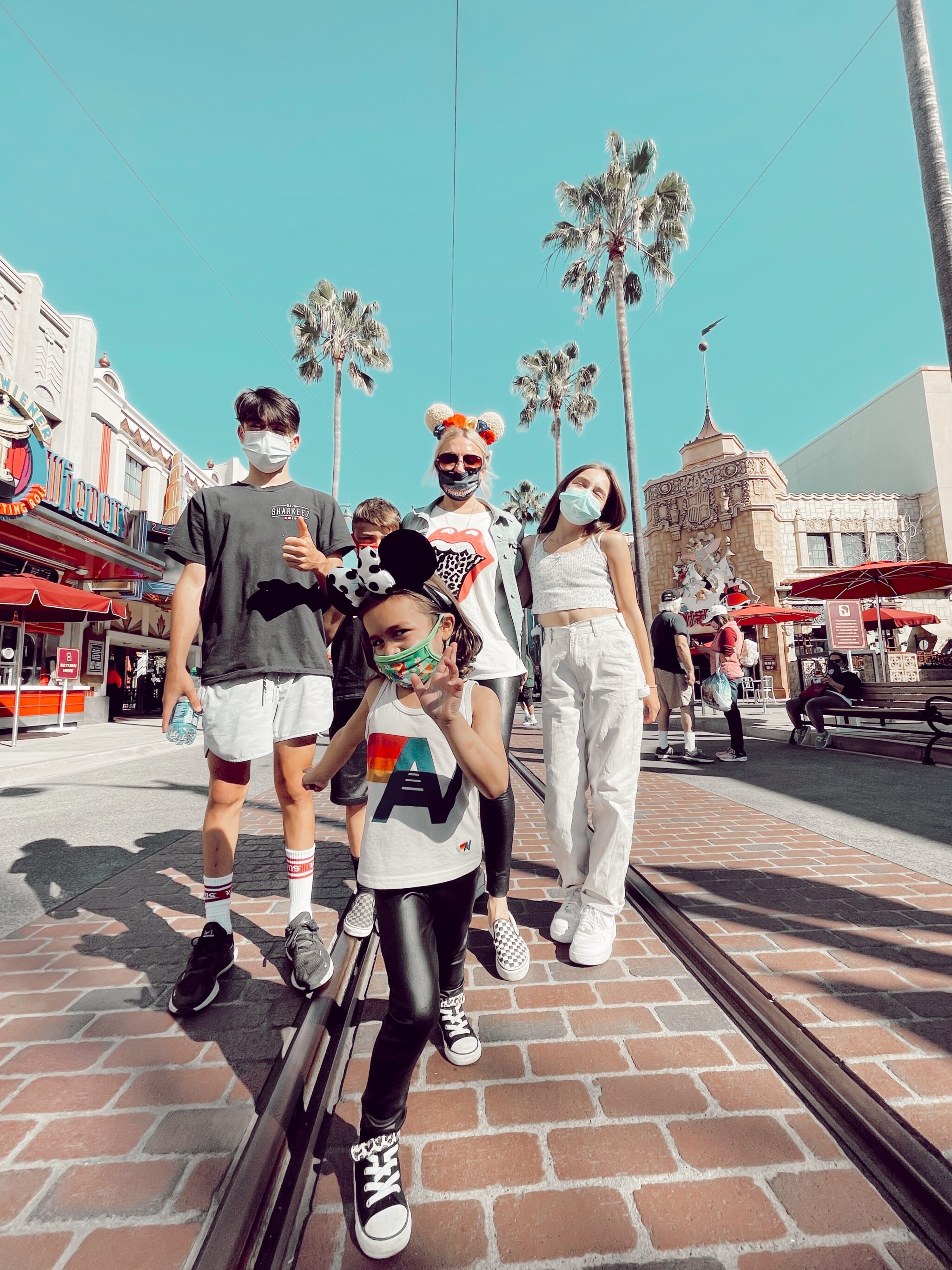 family walking through disneyland