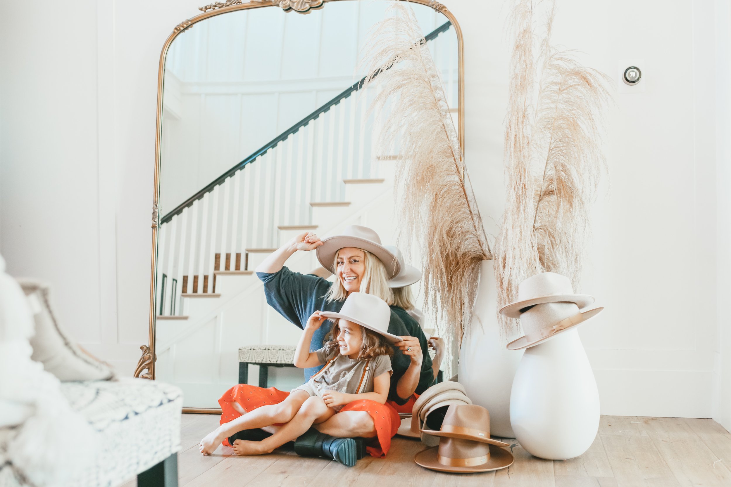 mom and son sitting by mirror