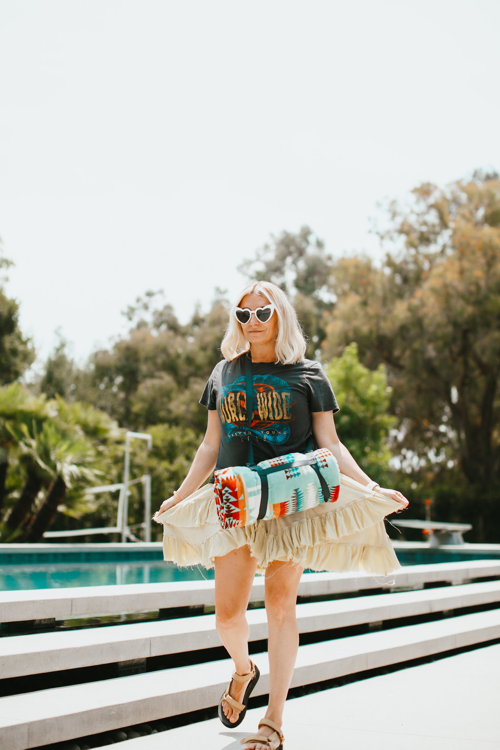 woman walking by the pool