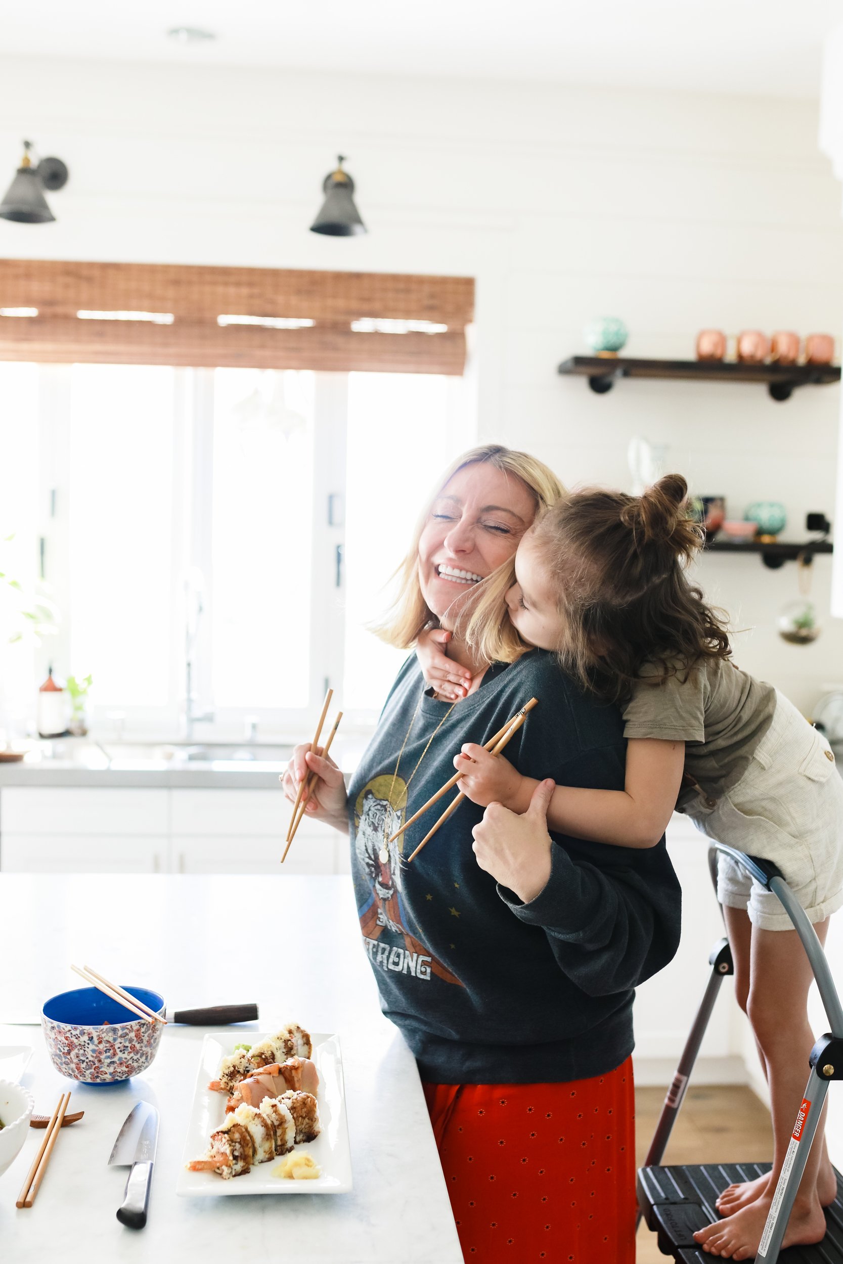 mom and child hugging in kitchen