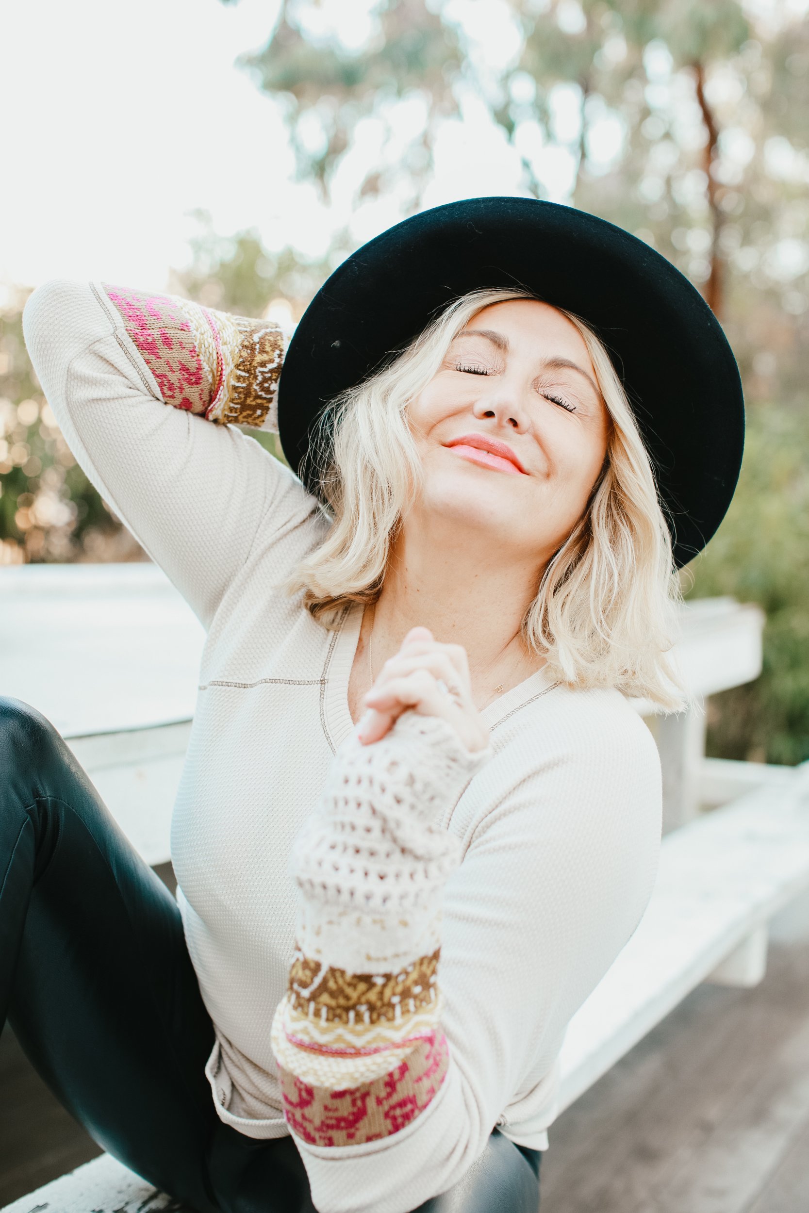 woman looking up closing her eyes