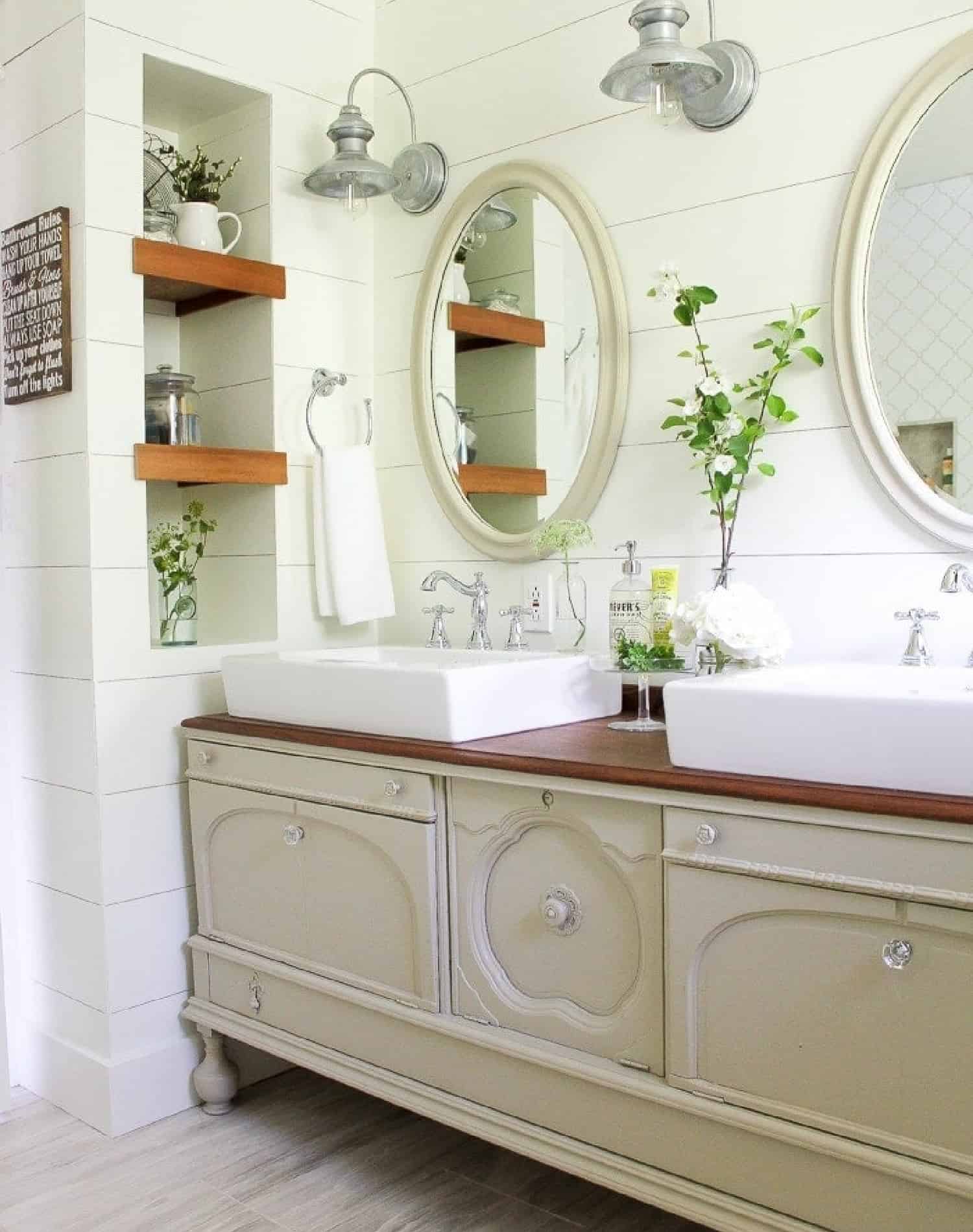 Traditional Farmhouse Bathroom in neutral colors and dual sinks.