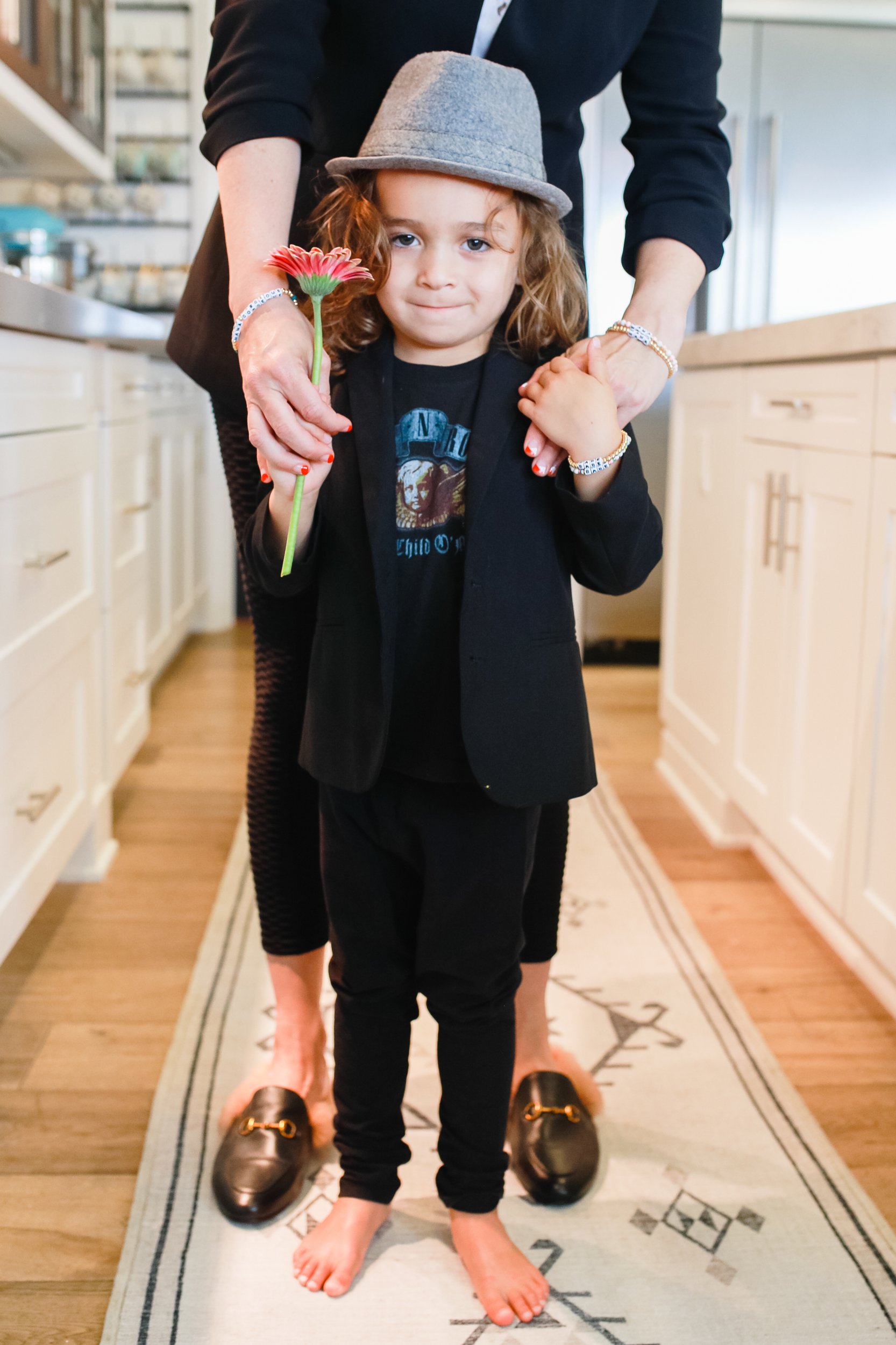 mom holding son's shoulders 