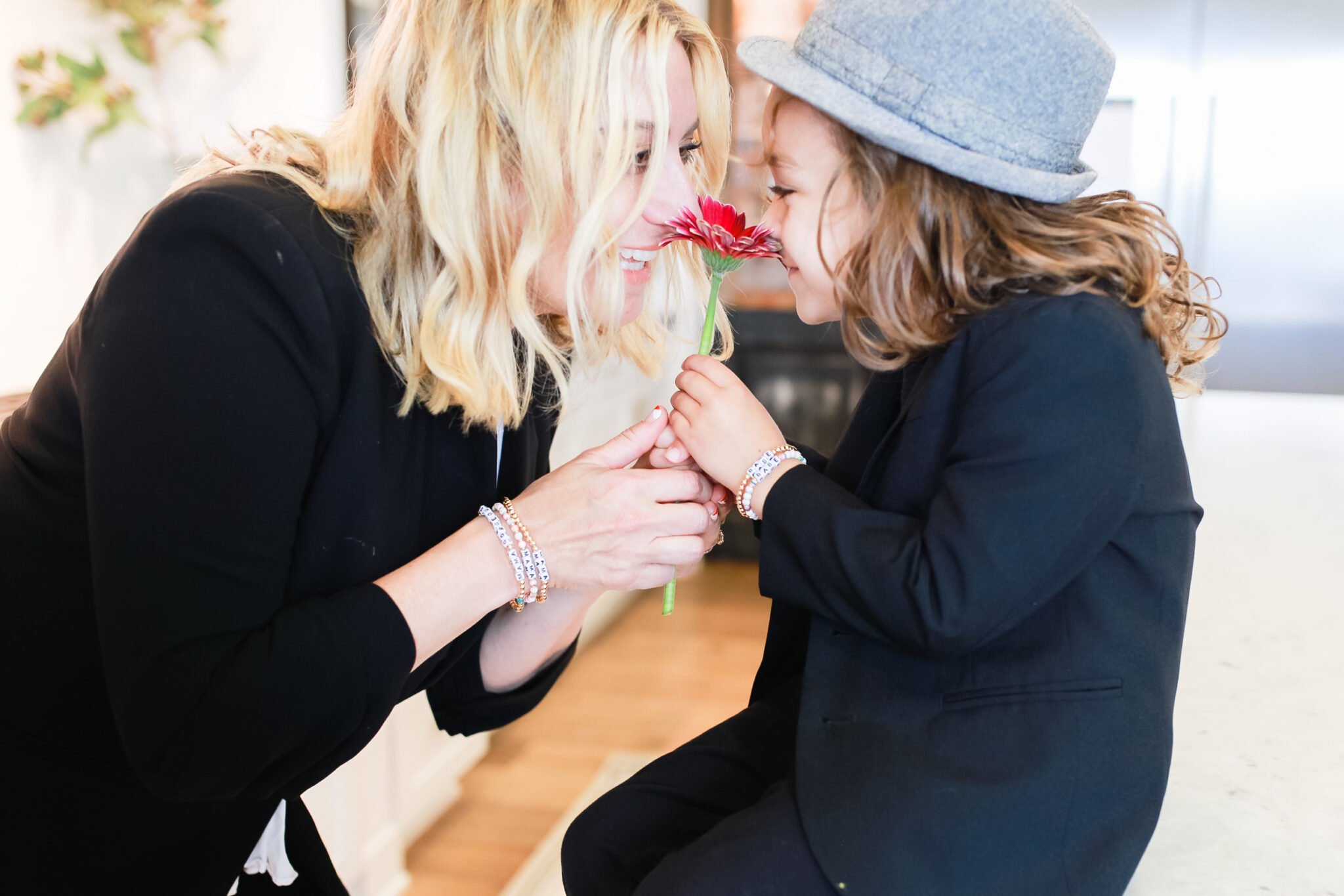 boy giving mom a flower