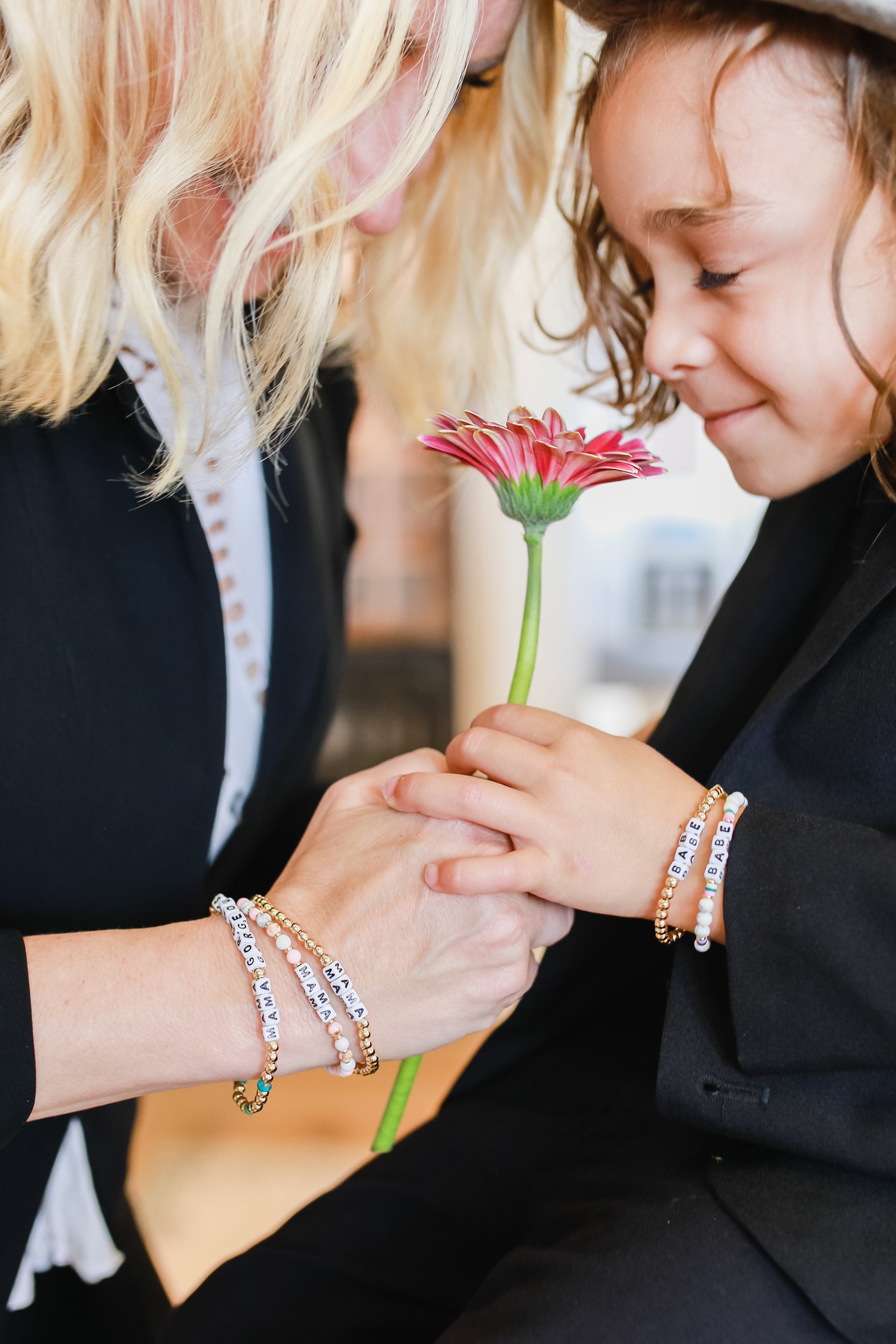 boy giving mom a flower