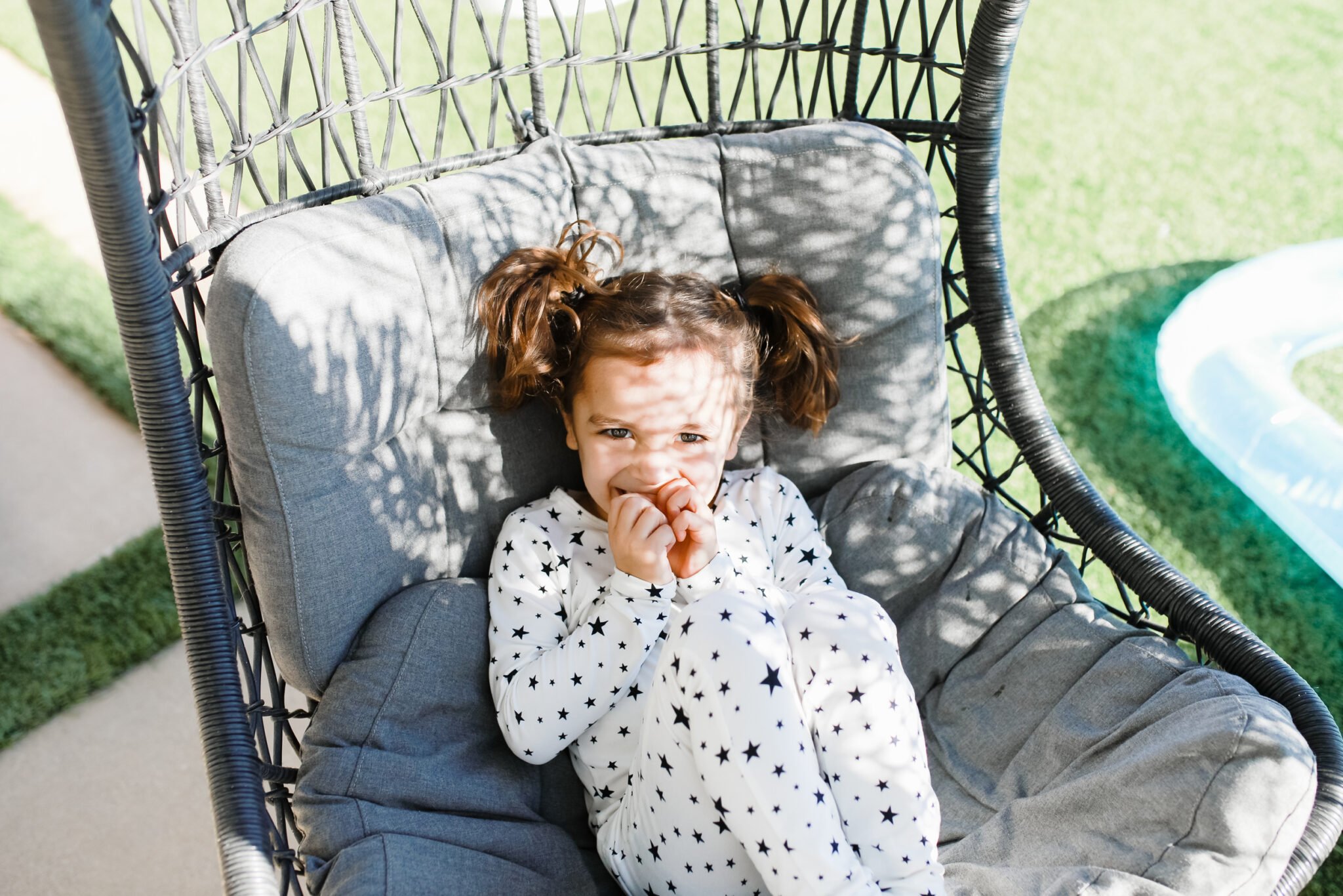 kid on outdoor chair