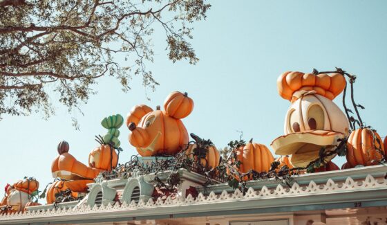 Disney characters in the shape of pumpkins outside Disneyland park.