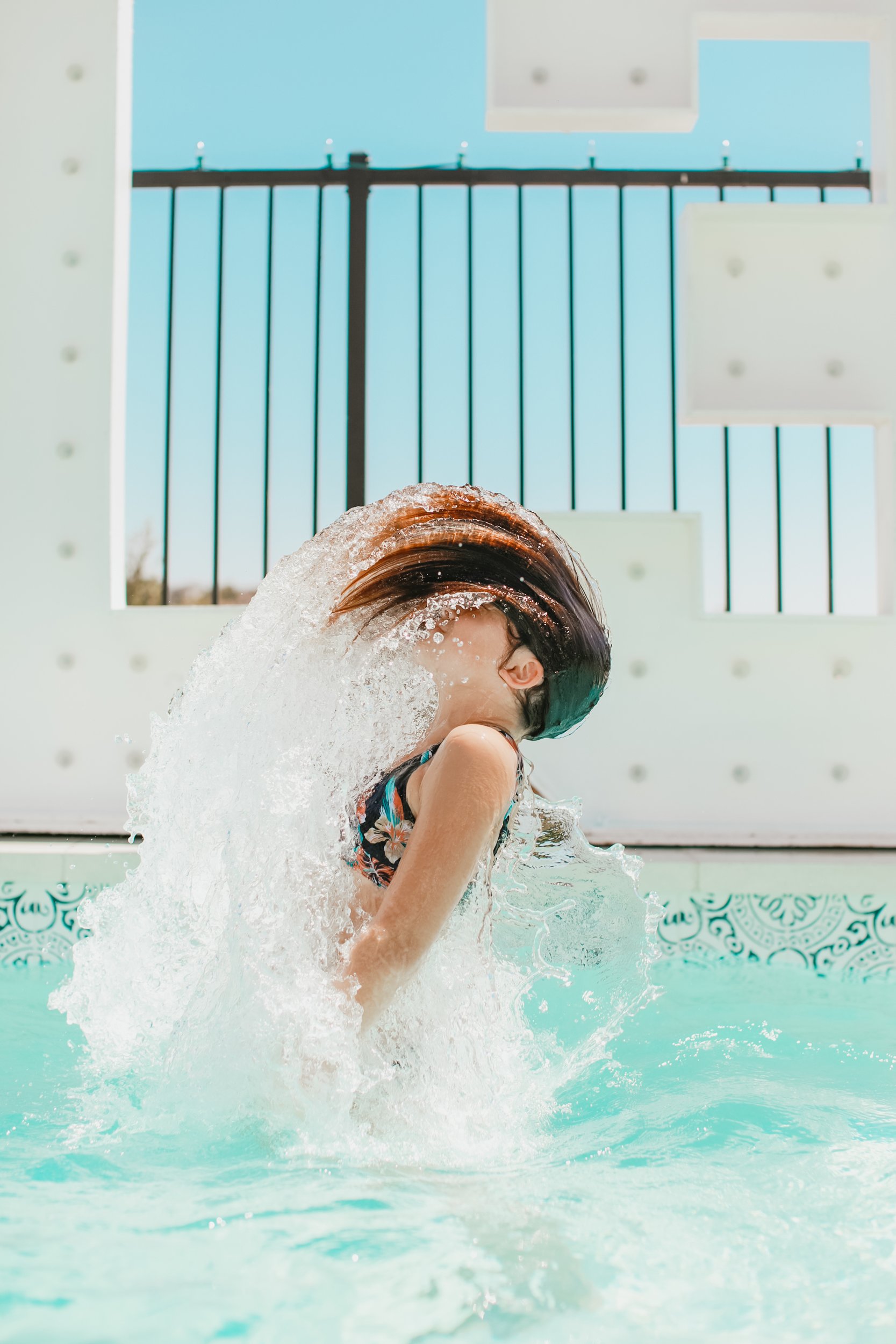 girl wet hair in pool