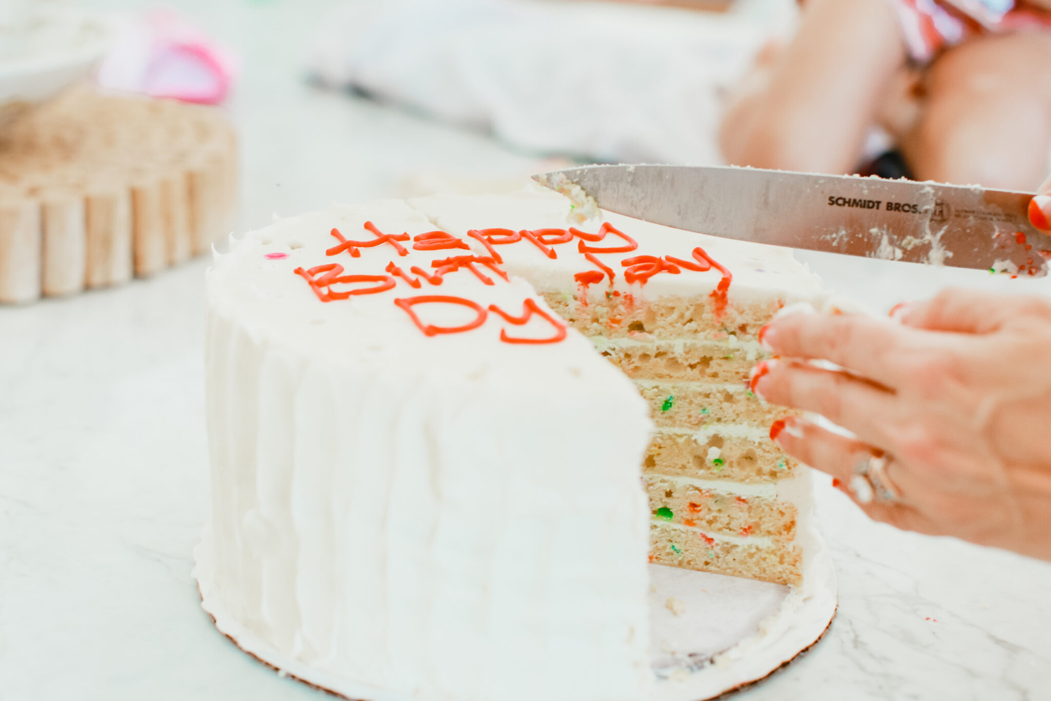 slicing birthday cake