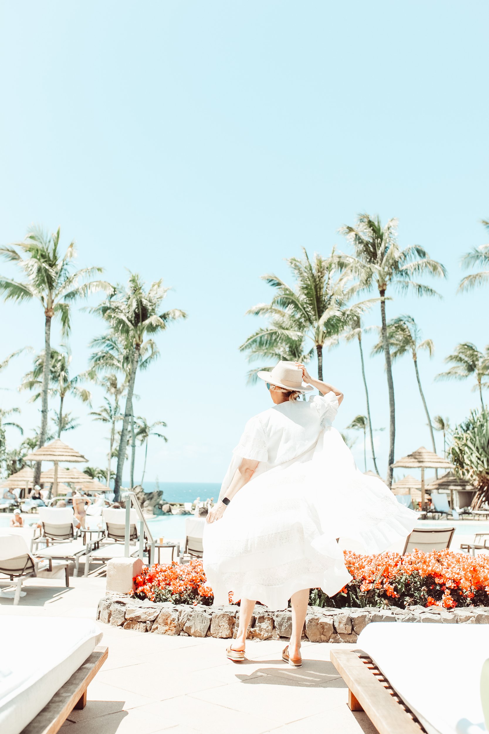 woman walking by the pool