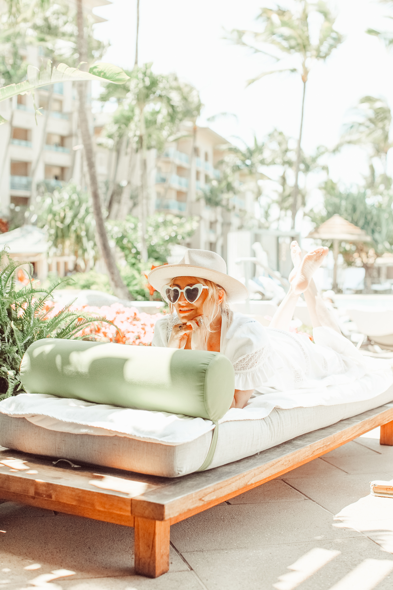 woman lounging at hotel pool