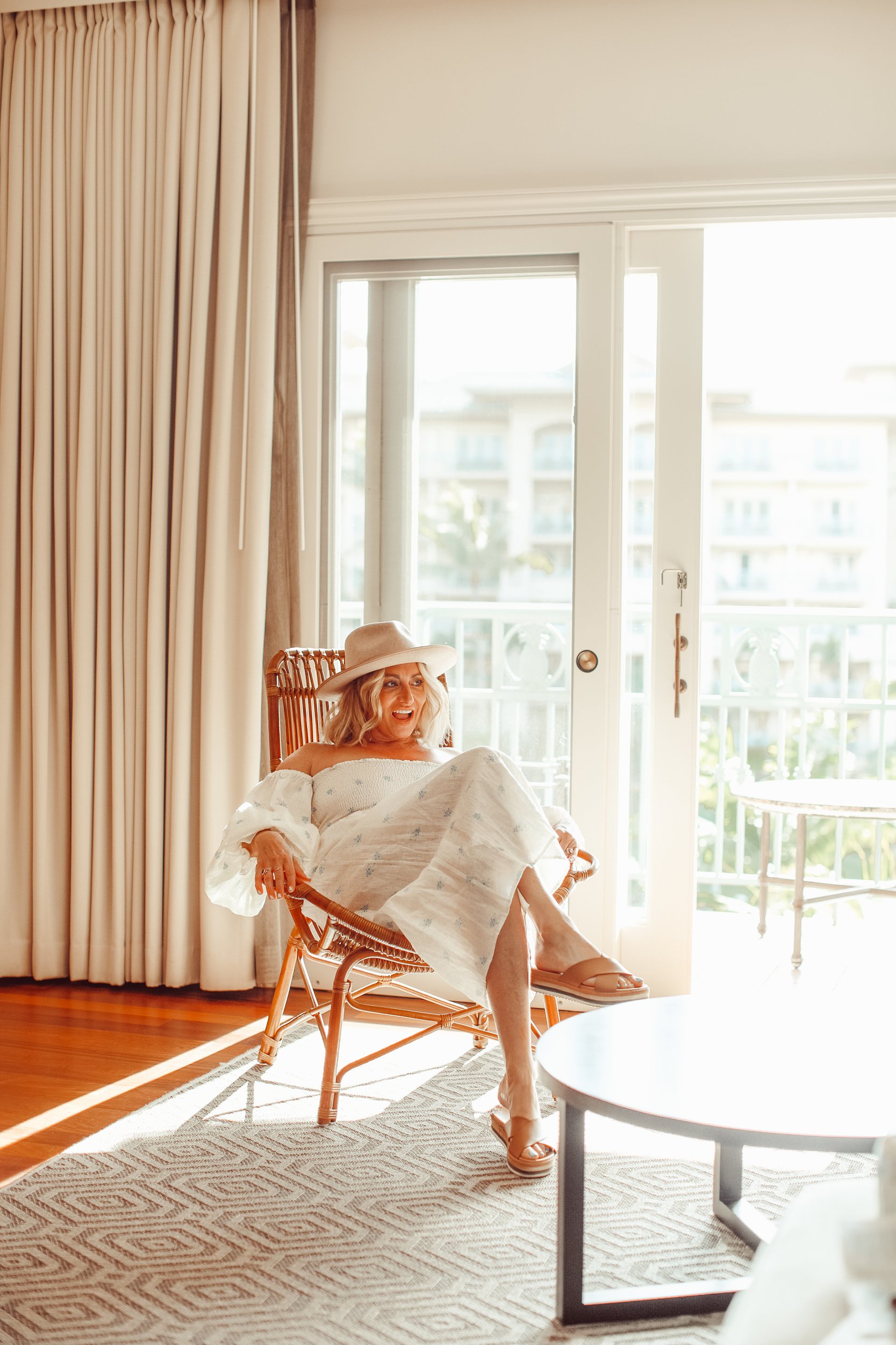 woman sitting in hotel room