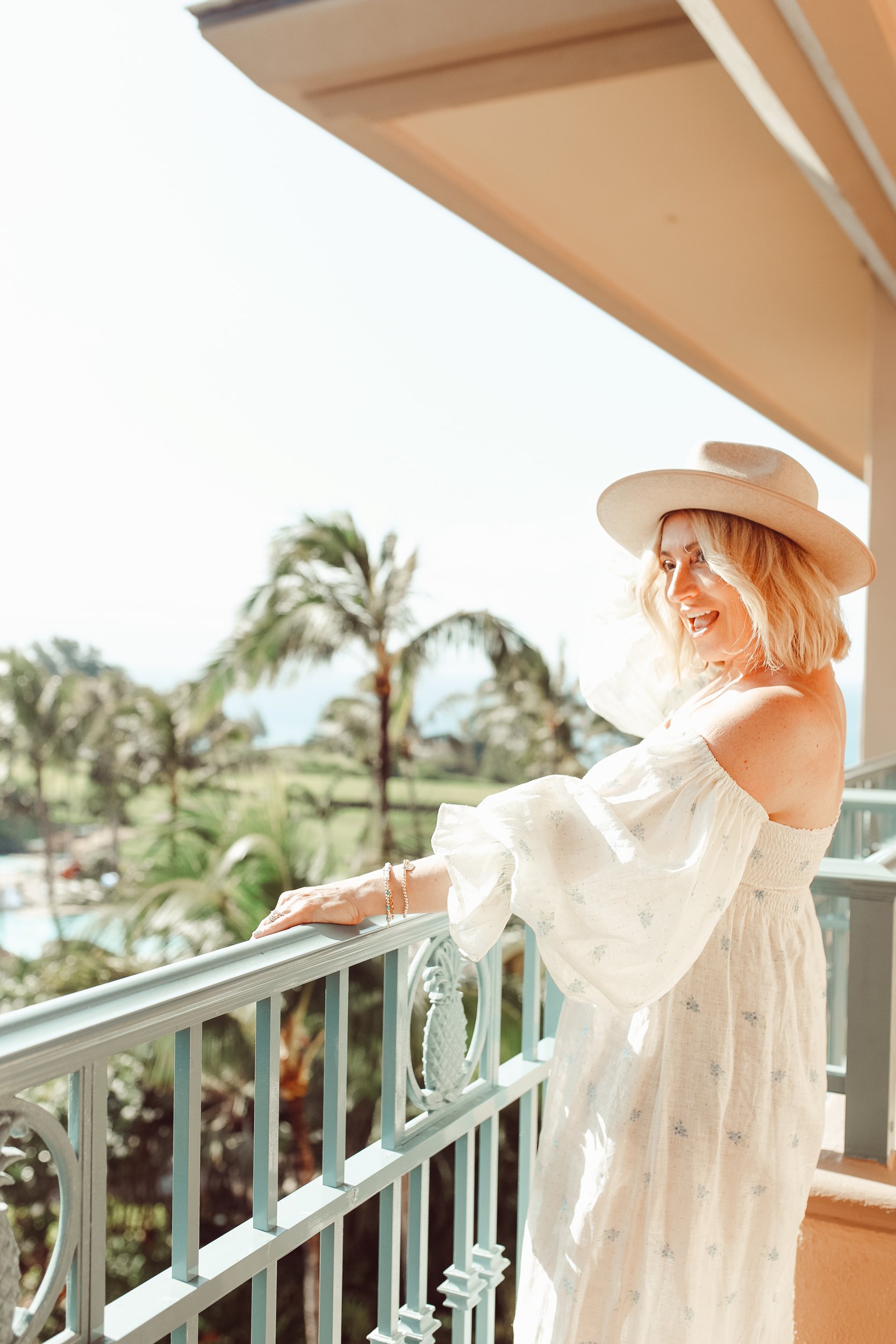 woman looking out over balcony