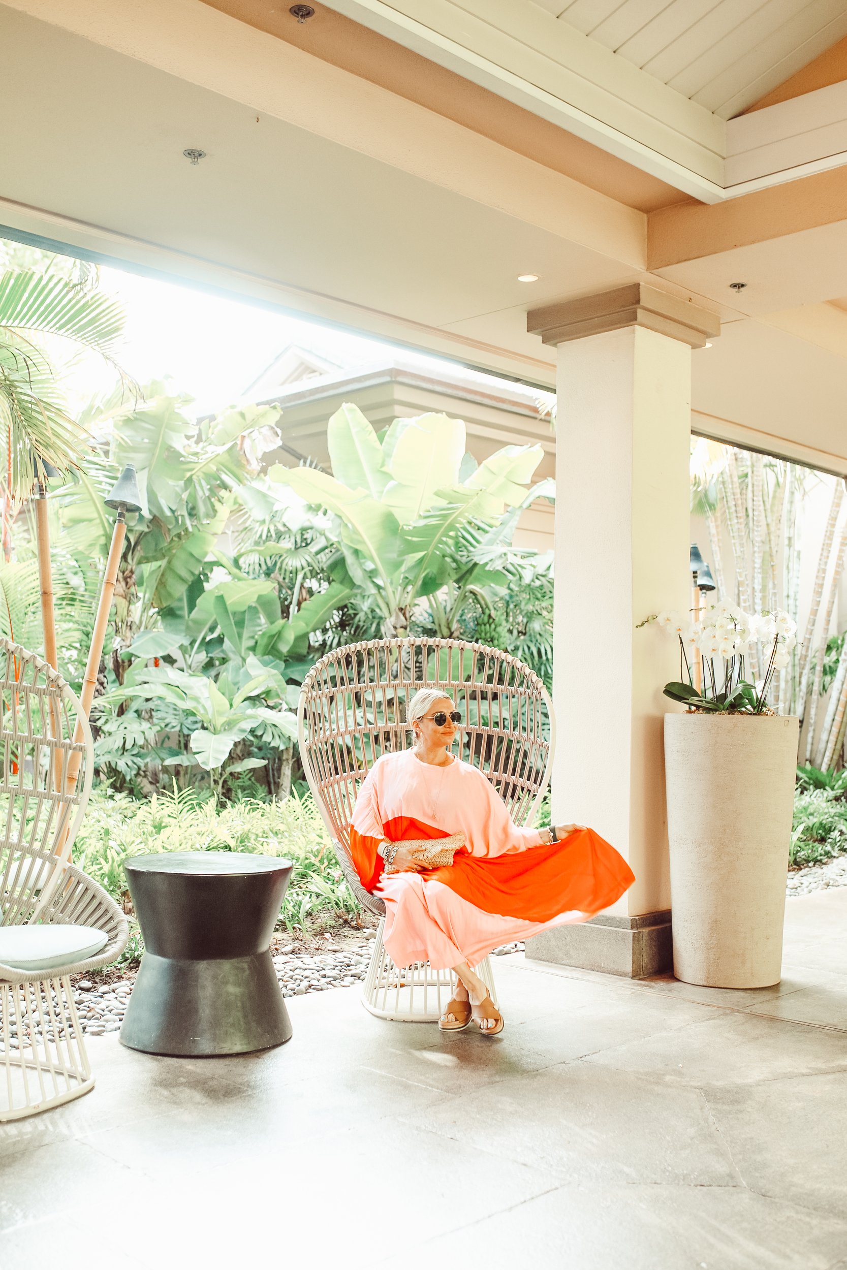 woman sitting in chair outdoors