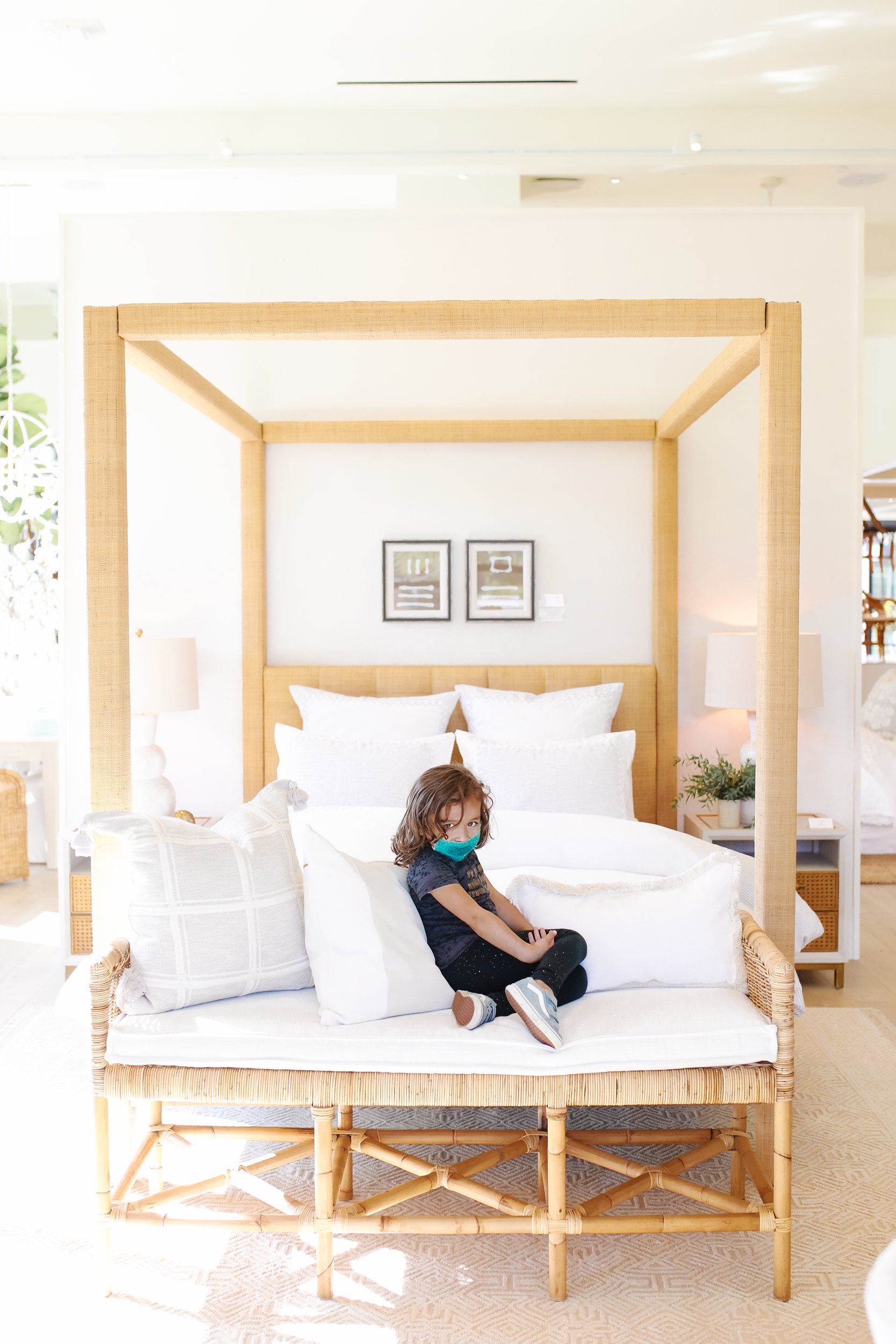 kid sitting on bed