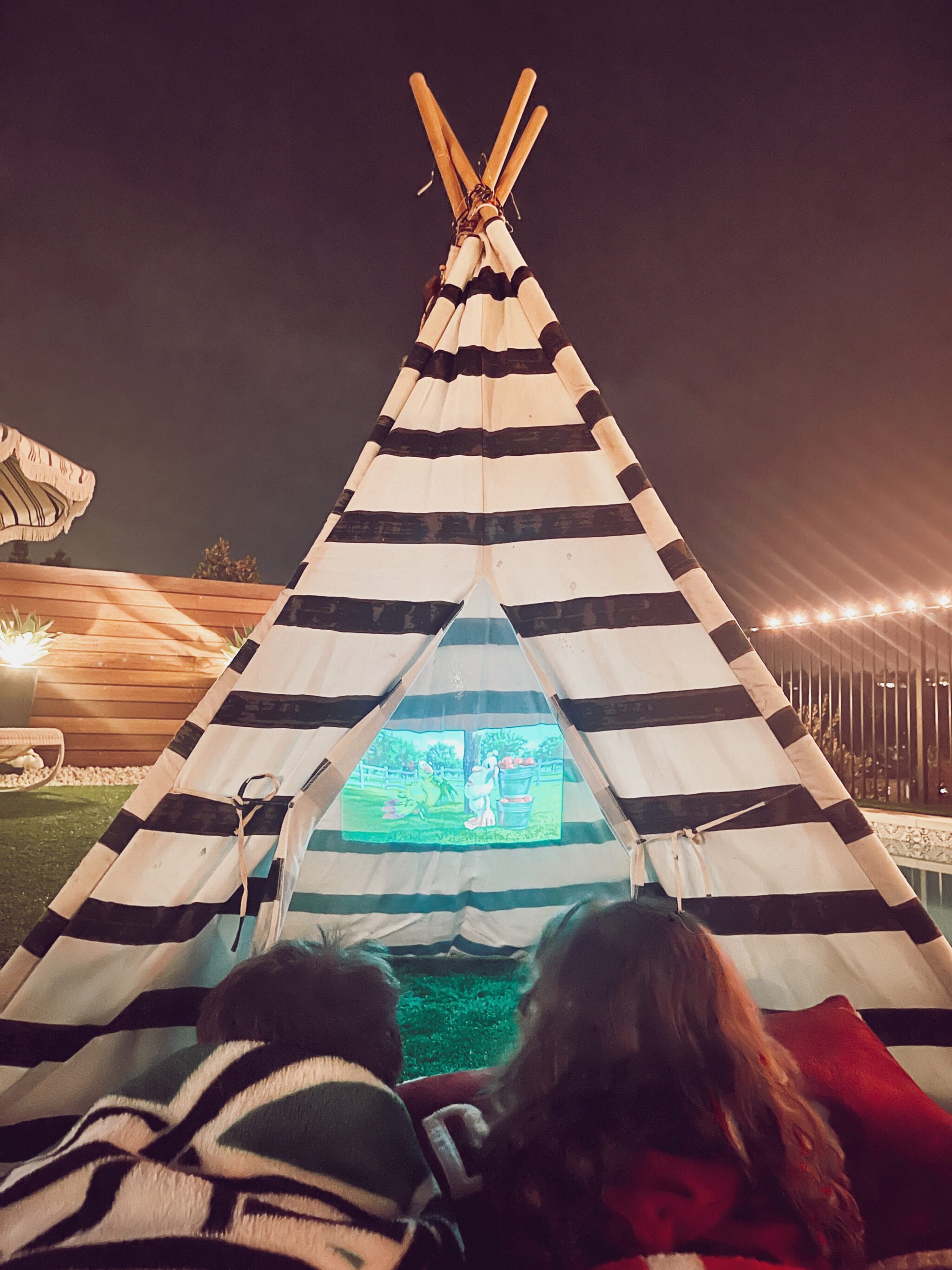 kids watching movies in teepee