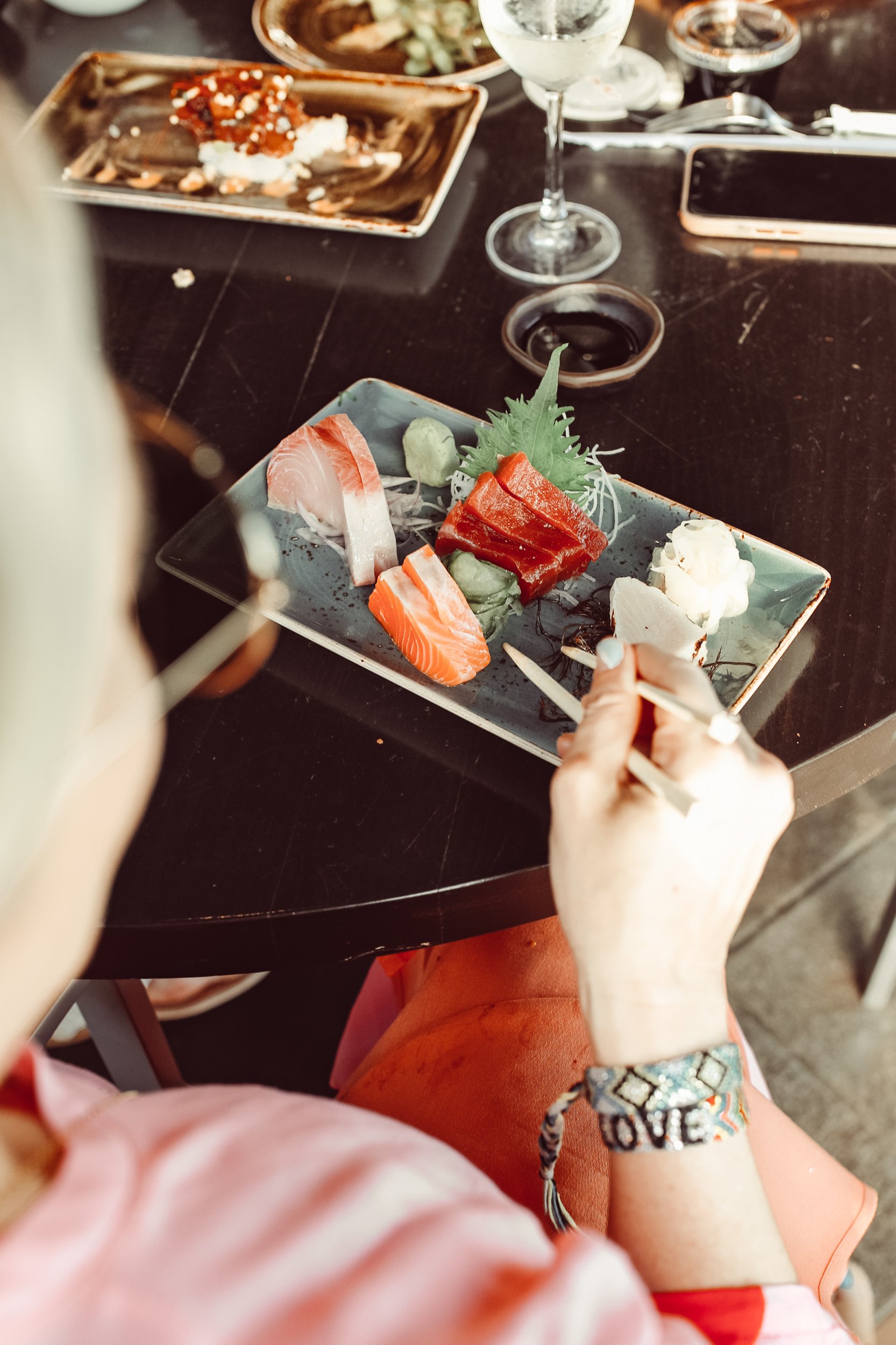 woman eating sushi