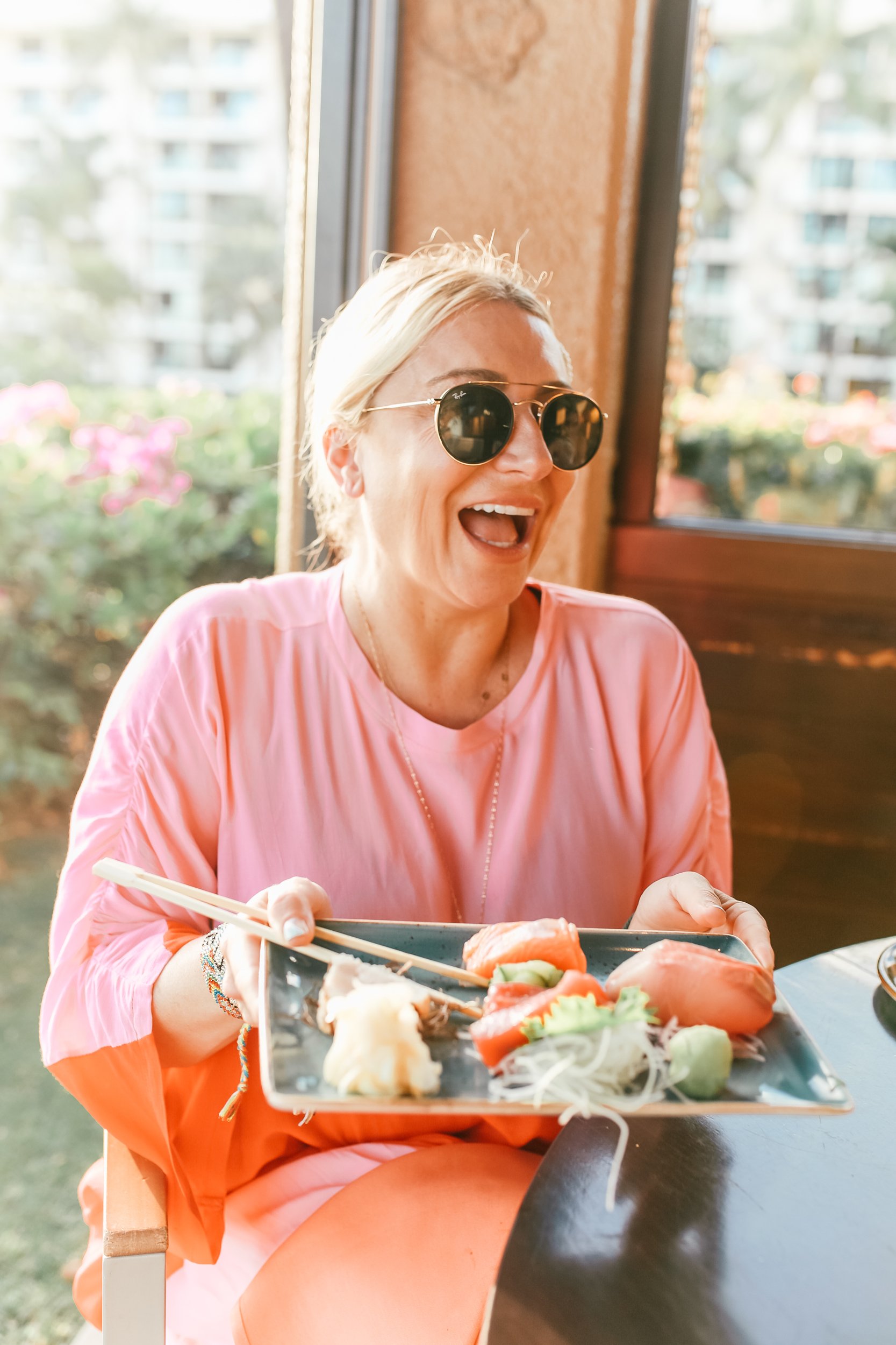 woman laughing at lunch