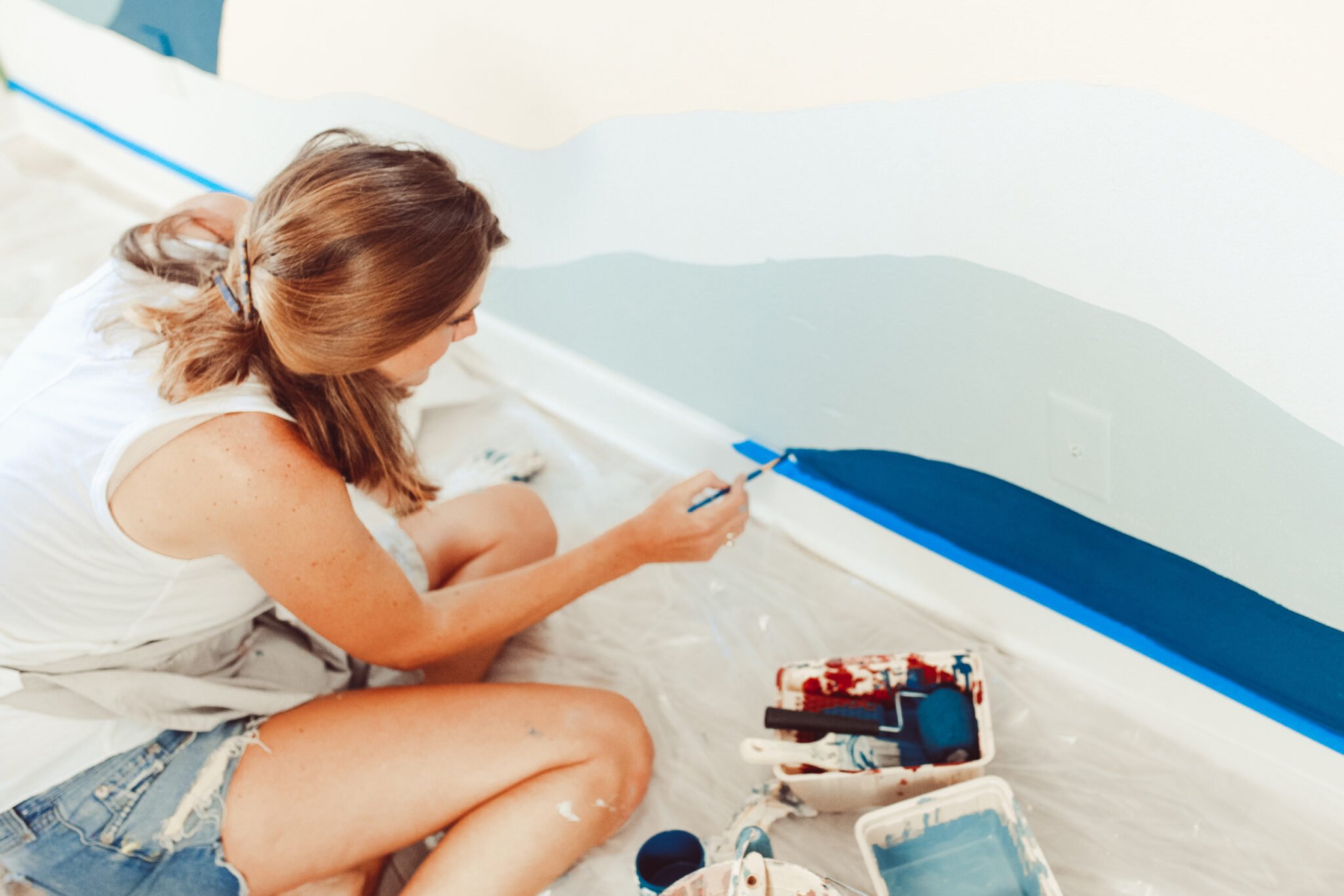 woman painting wall