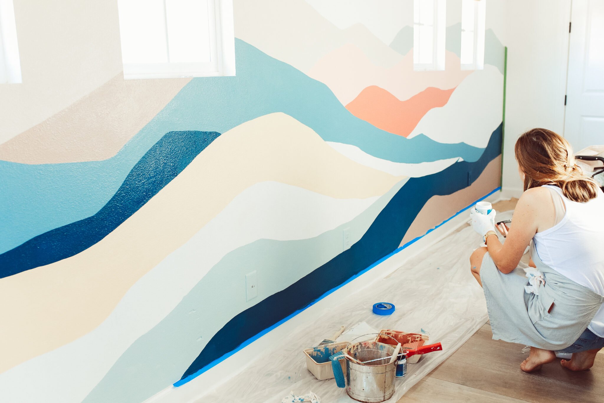 woman painting a wall