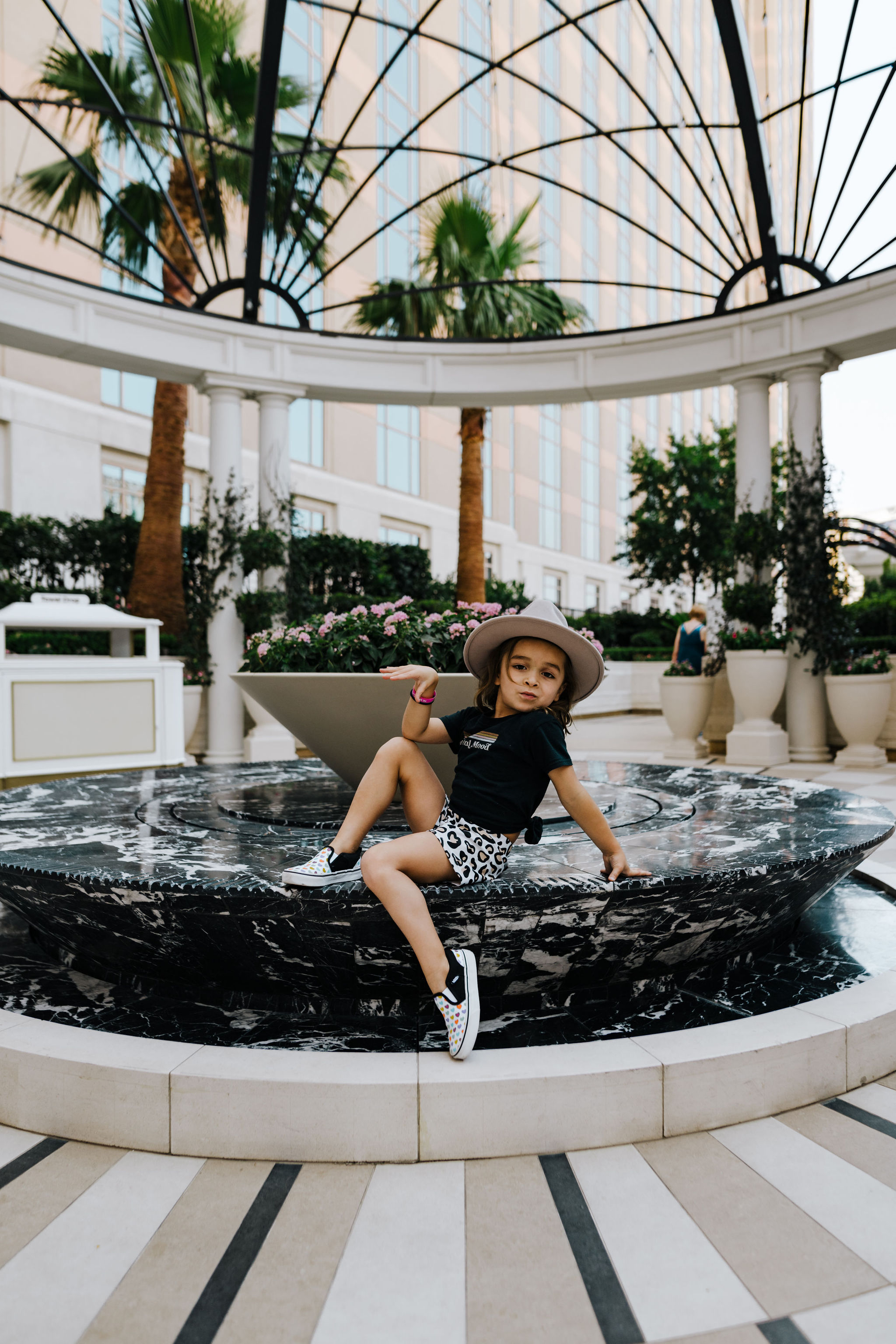 boy posing on fountain