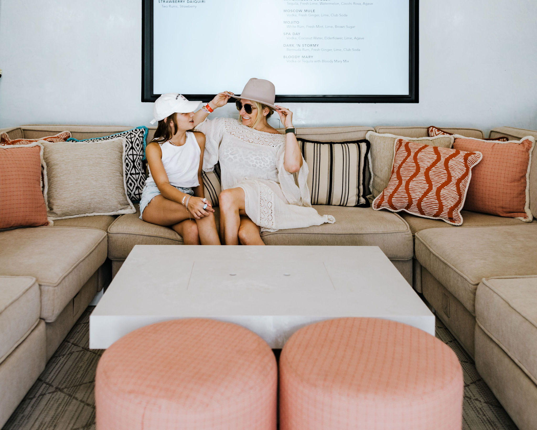 mom and daughter sitting on couch