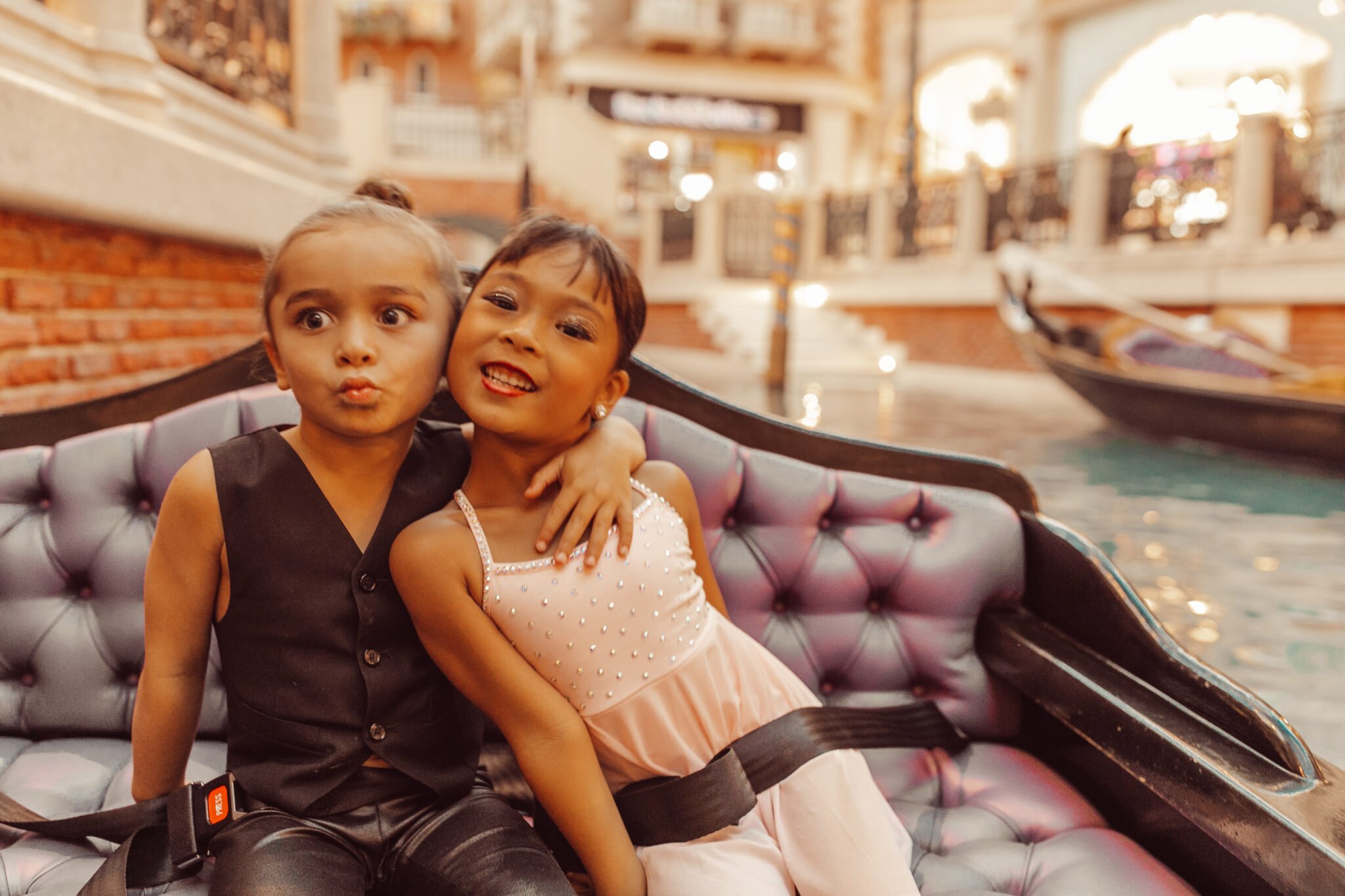 kids on venetian gondola 