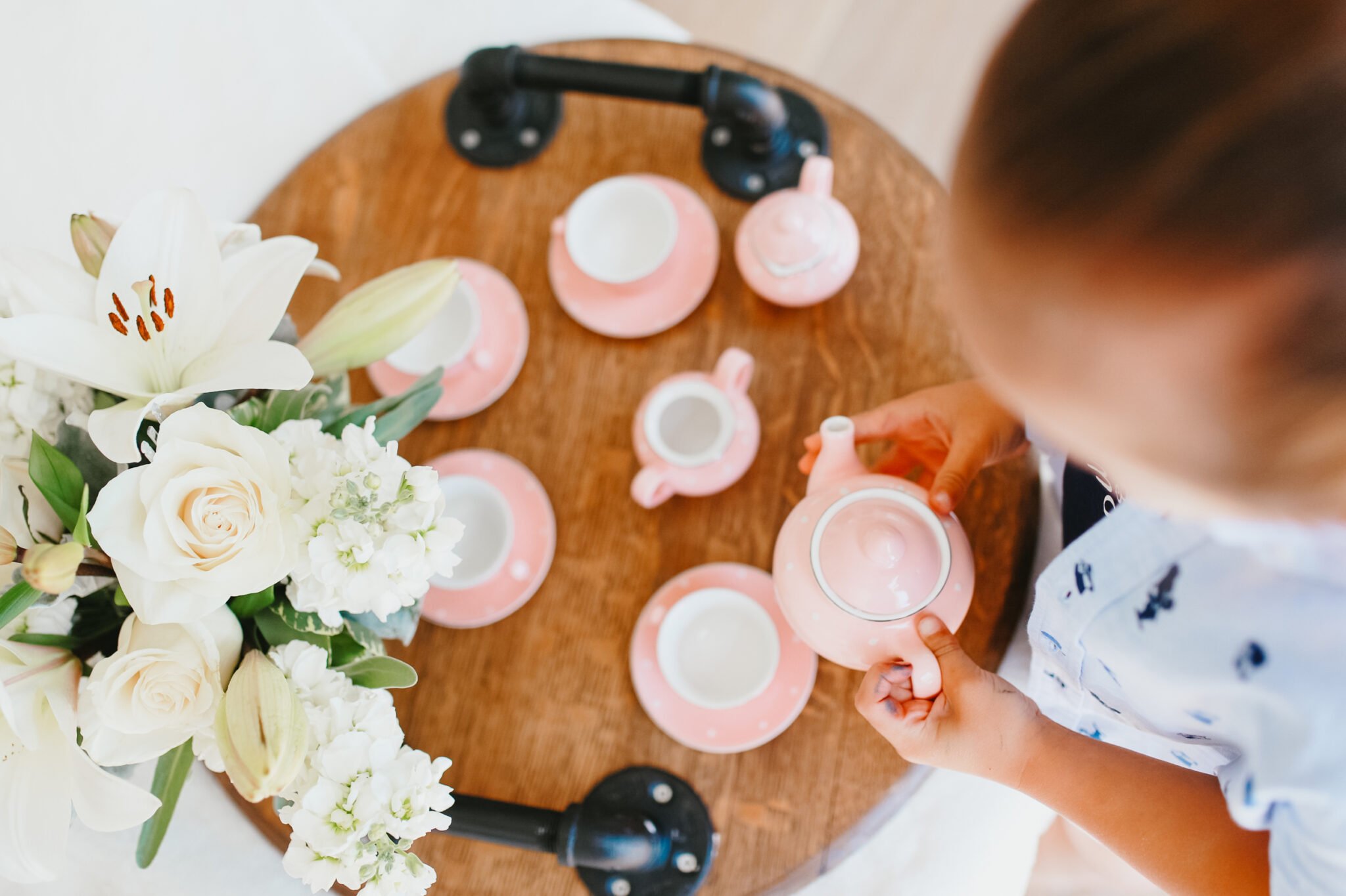 child with tea set