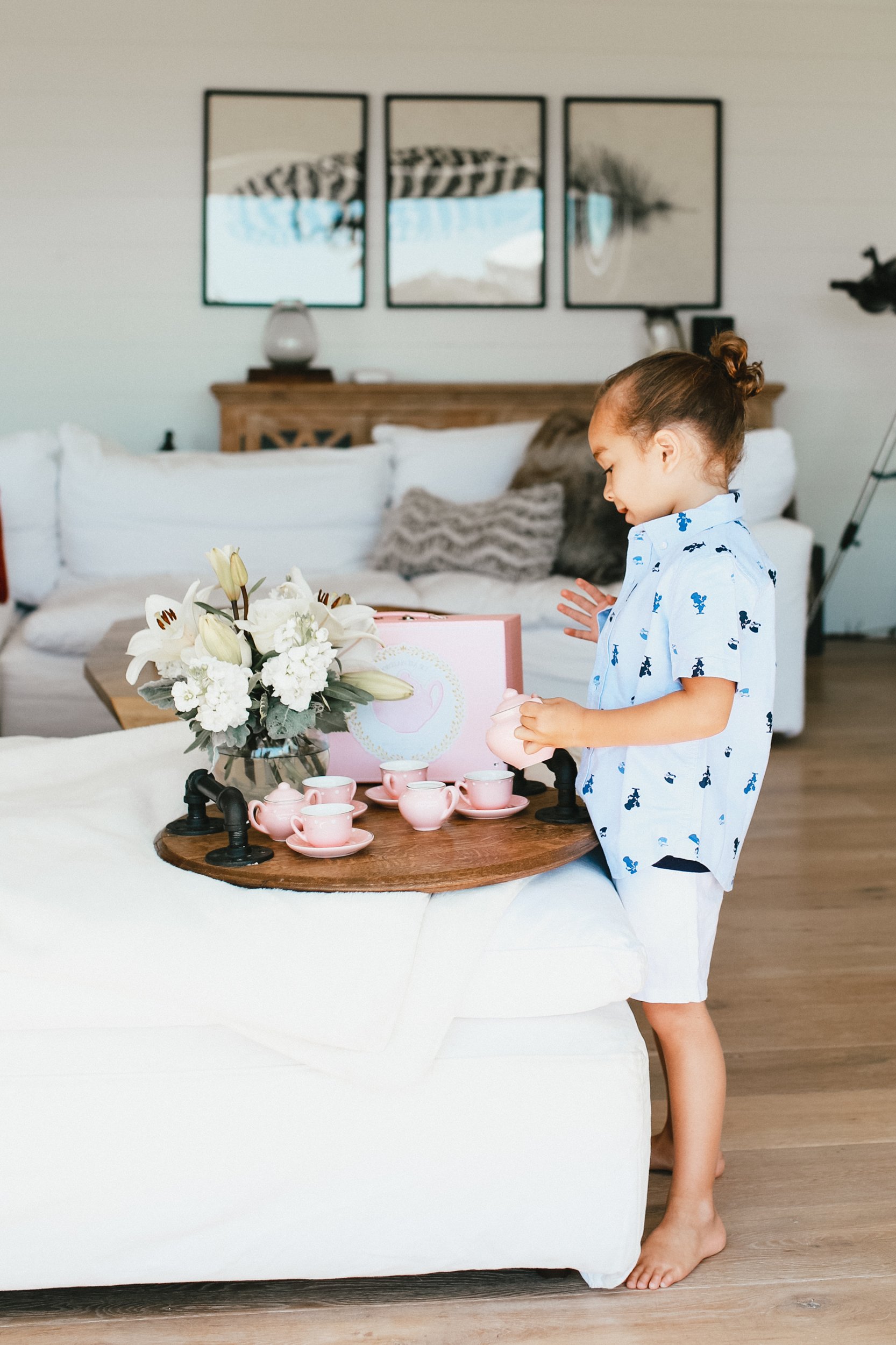 child playing with tea set